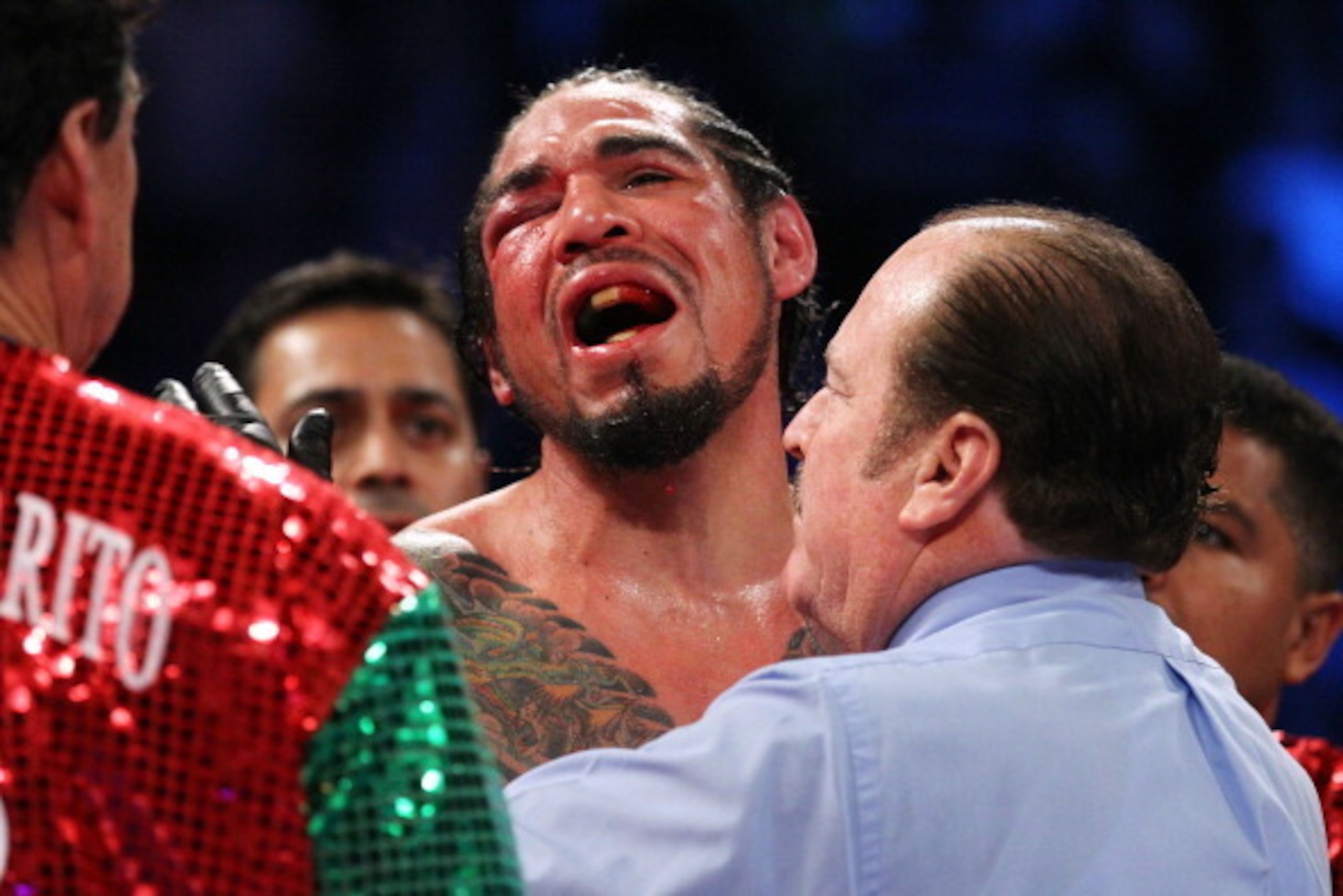 NEW YORK, NY - DECEMBER 03:  Antonio Margarito of Mexico reacts after referee Steve Smoger (R) calls the fight due to Margarito's closed right eye against Miguel Cotto of Puerto Rico in the tenth round during the WBA World Junior Middleweight Title fight 
