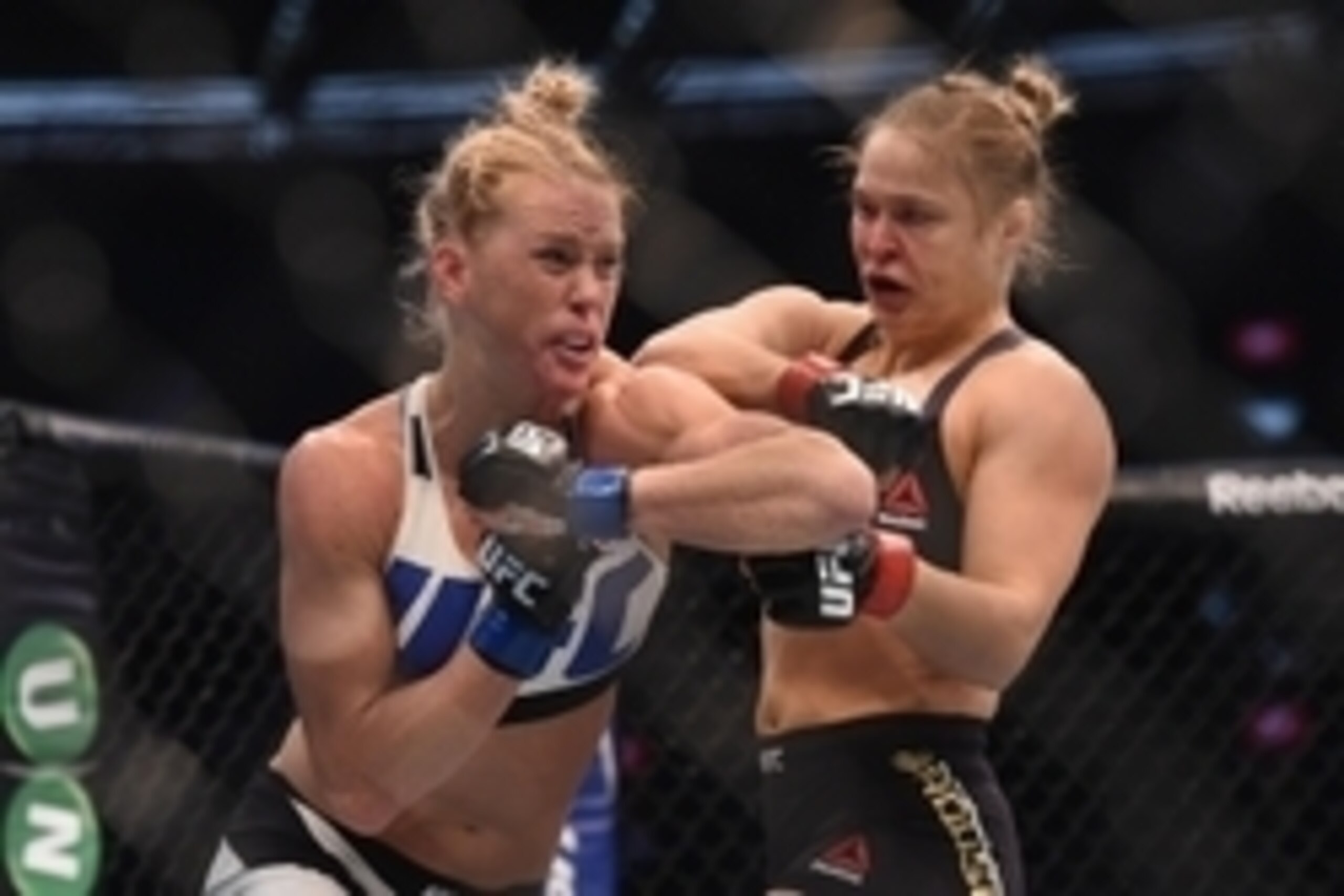 Nov 15, 2015; Melbourne, Australia; Ronda Rousey (red gloves) competes against Holly Holm (blue gloves) during UFC 193 at Etihad Stadium. Mandatory Credit: Matt Roberts-USA TODAY Sports