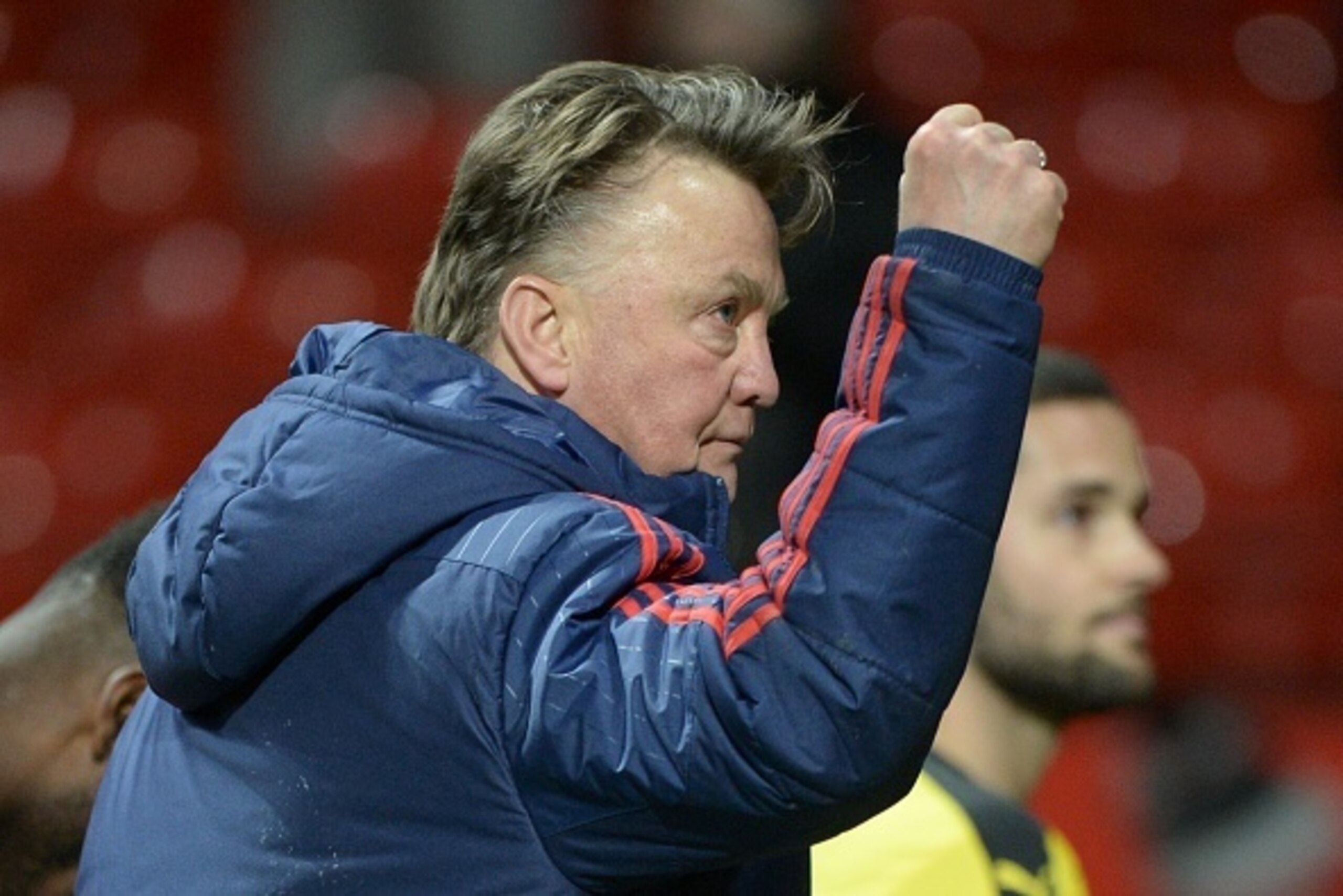 Manchester United's Dutch manager Louis van Gaal raises his fist at the end of the English Premier League football match between Manchester United and Watford at Old Trafford in Manchester in north west England on March 2, 2016. / AFP / OLI SCARFF / RESTR
