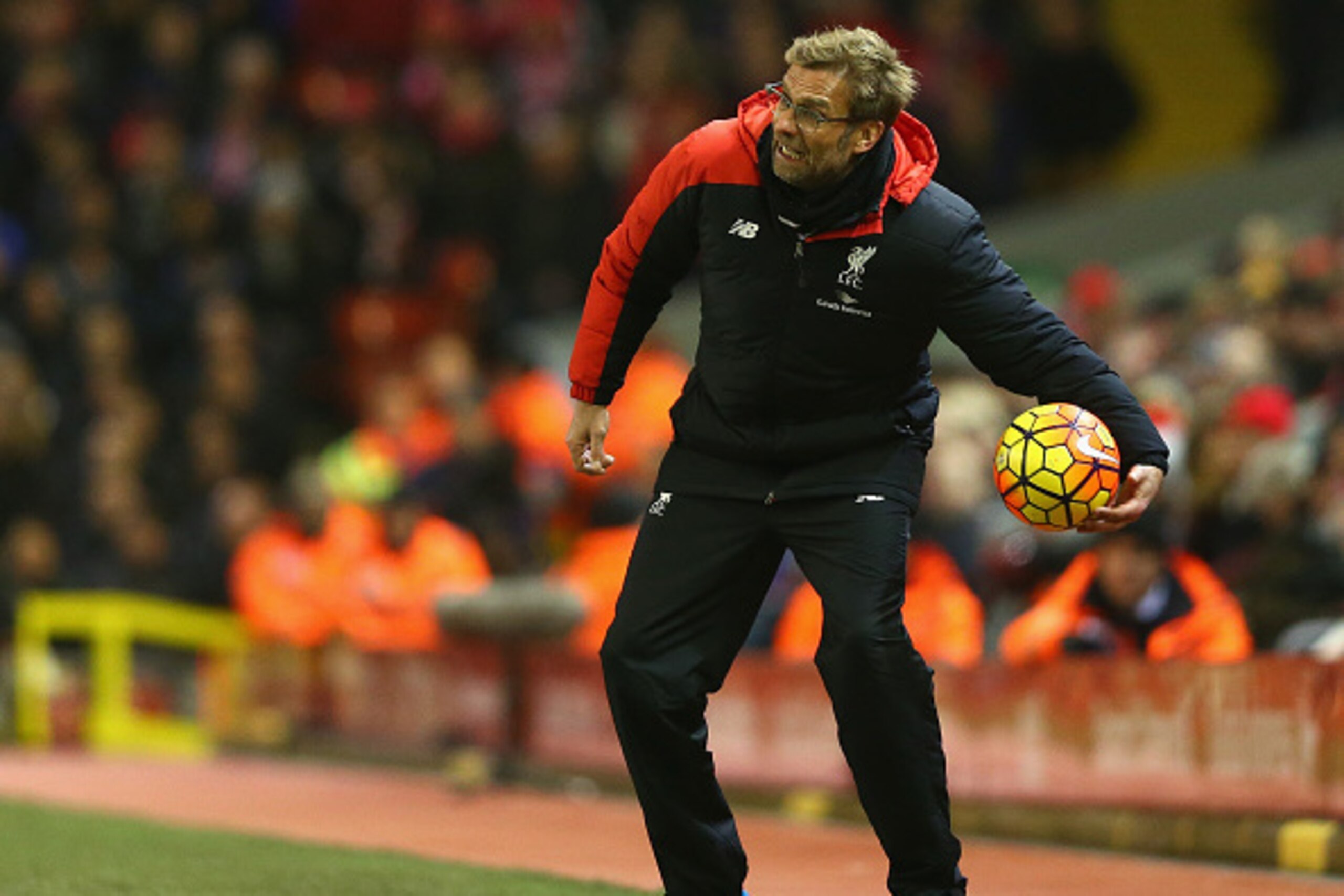 LIVERPOOL, ENGLAND - MARCH 02:  Jurgen Klopp manager of Liverpool holding the match ball during the Barclays Premier League match between Liverpool and Manchester City at Anfield on March 2, 2016 in Liverpool, England.  (Photo by Clive Brunskill/Getty Ima