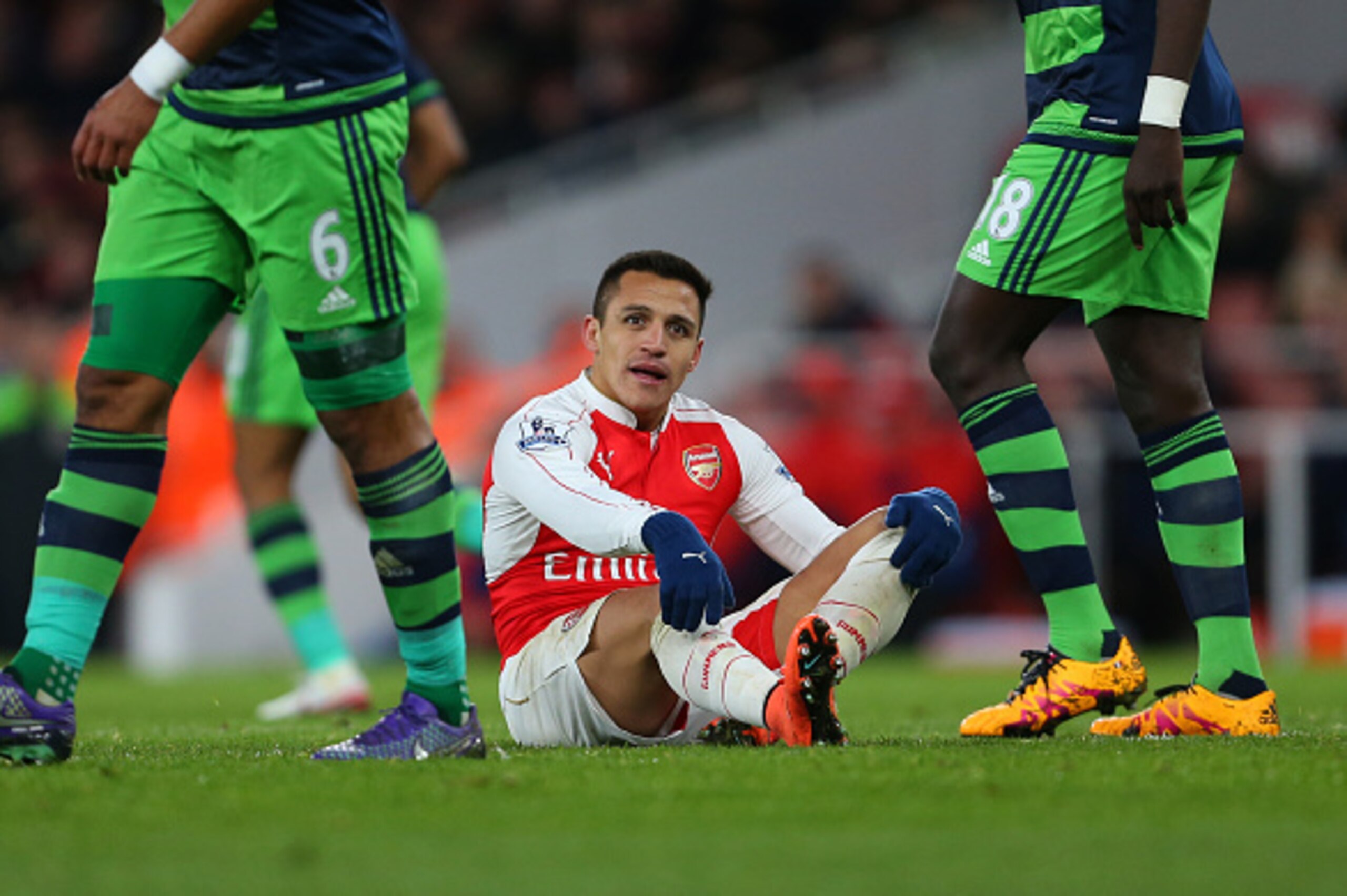 LONDON, ENGLAND - MARCH 02 :  Alexis Sanchez of Arsenal sits on the pitch during the Barclays Premier League match between Arsenal and Swansea City at the Emirates Stadium on March 02, 2016 in London, England.  (Photo by Catherine Ivill - AMA/Getty Images