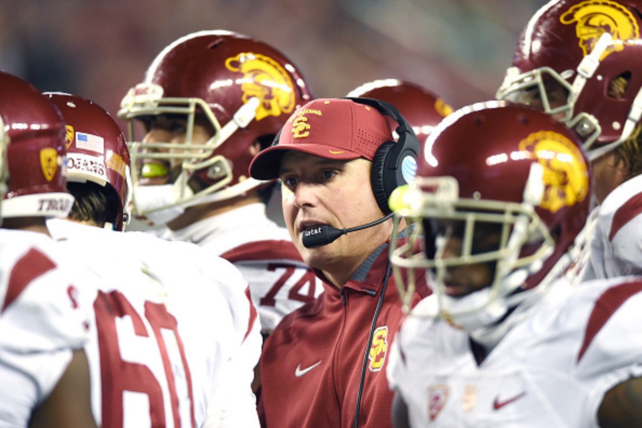 SANTA CLARA, CA - DECEMBER 05:  Head coach Clay Helton of the USC Trojans talks with his players while there's a time-out against the Stanford Cardinal during the second quarter of the NCAA Pac-12 Championship game at Levi's Stadium on December 5, 2015 in