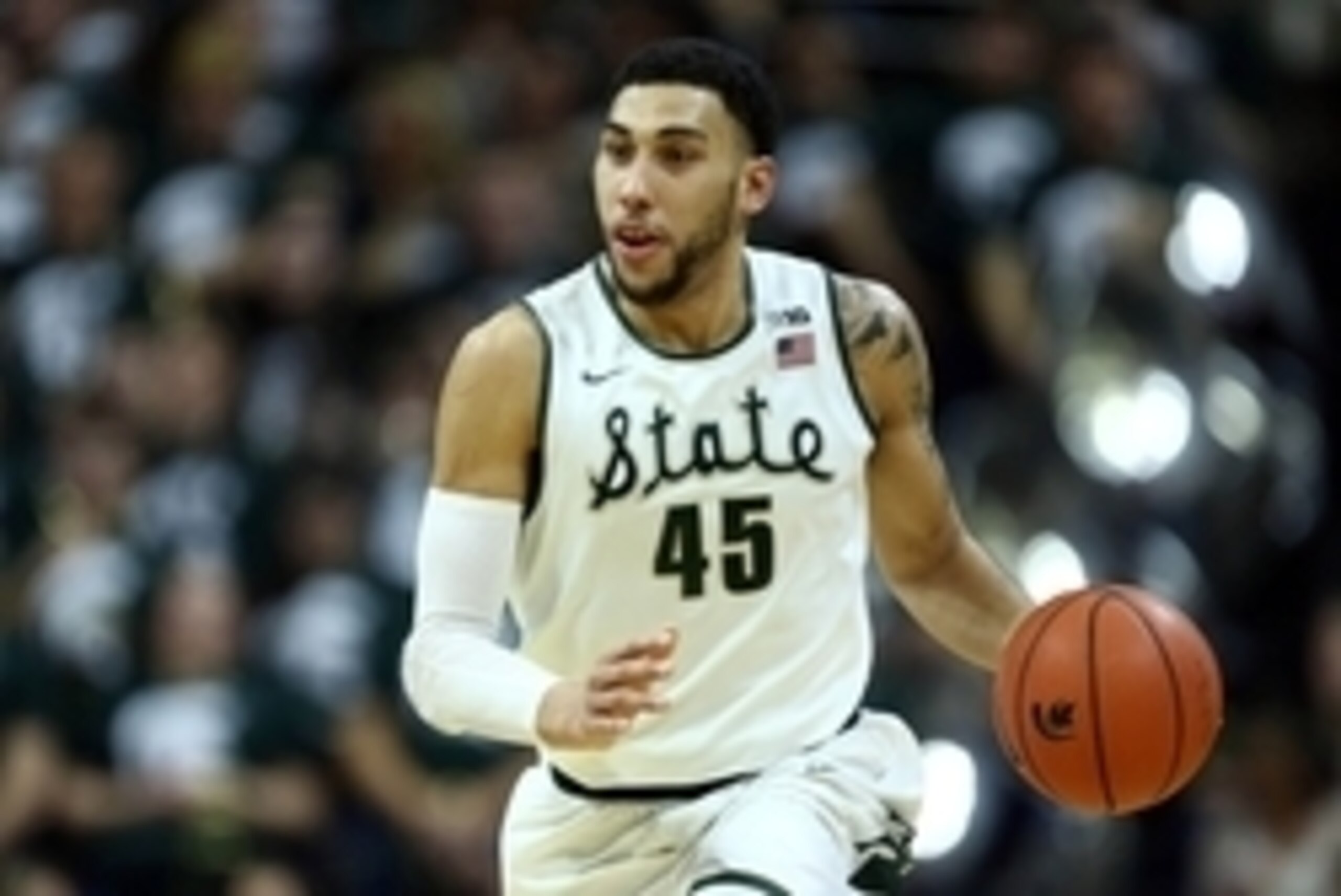 Feb 18, 2016; East Lansing, MI, USA; Michigan State Spartans guard Denzel Valentine (45) brings the ball up court during the second half of a game against the Wisconsin Badgers at Jack Breslin Student Events Center. Mandatory Credit: Mike Carter-USA TODAY