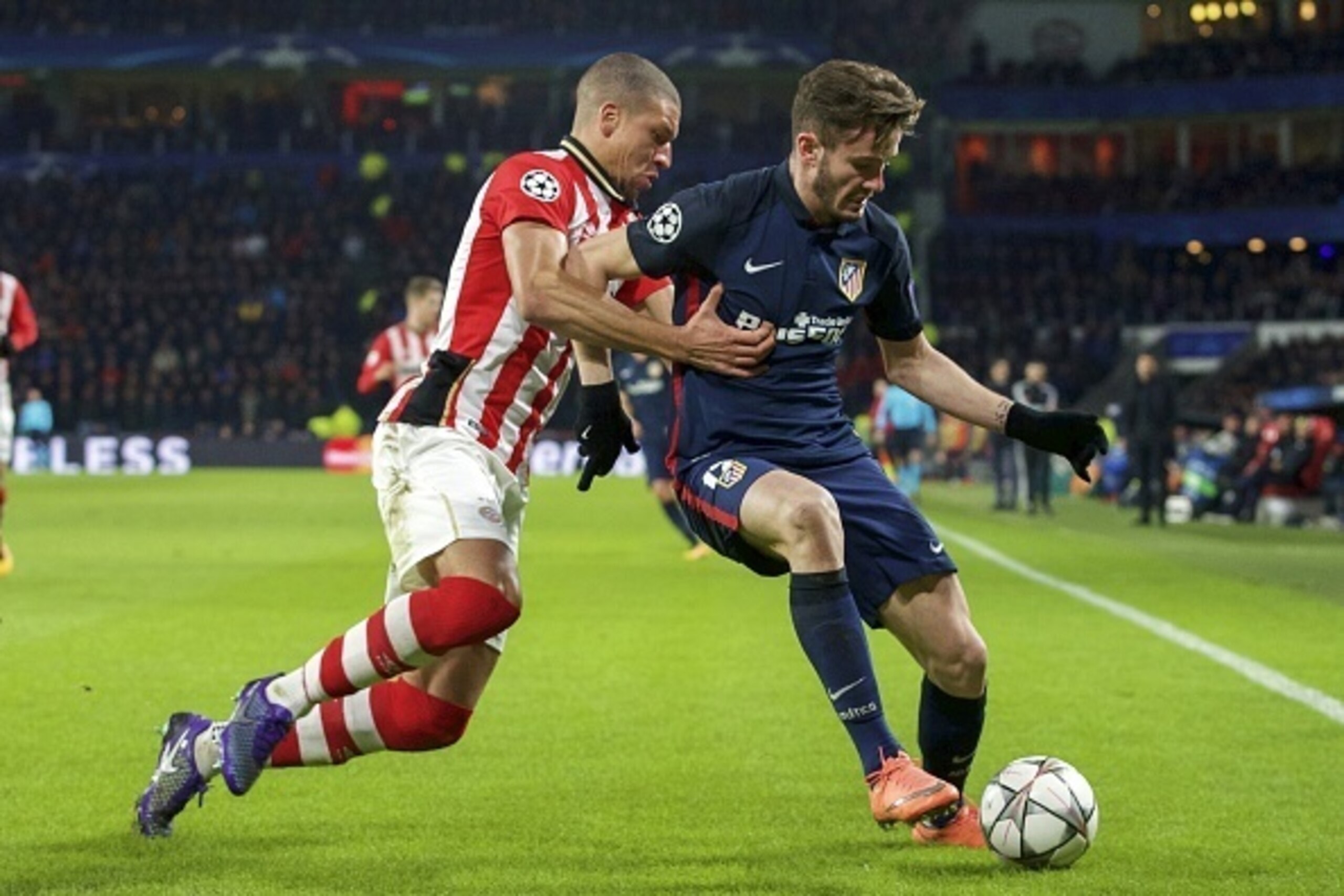 (L-R) Jeffrey Bruma of PSV, Saul Niguez of Club Atletico de Madrid during the UEFA Champions League Round of 16, First leg match between PSV Eindhoven and Atletico Madrid on February 24, 2016 at the Philips stadium in Eindhoven, The Netherlands.(Photo by 