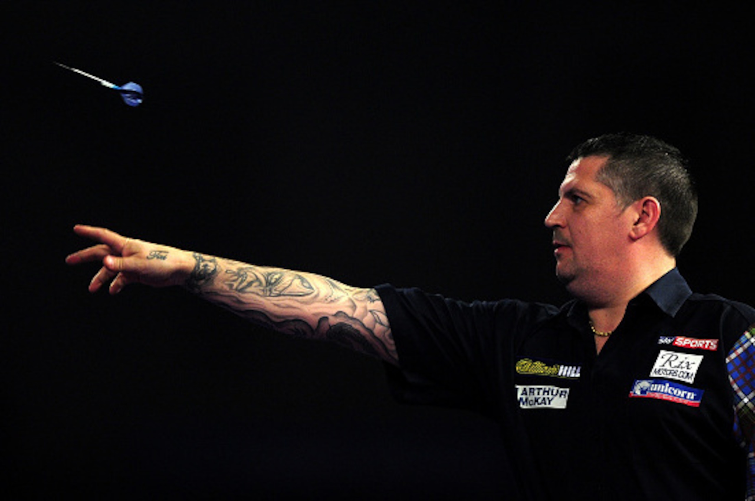 LONDON, ENGLAND - JANUARY 03:  Gary Anderson of Scotland throws during the final match against Adrian Lewis of England during Day Fifteen of the 2016 William Hill PDC World Darts Championships at Alexandra Palace on January 3, 2016 in London, England.  (P