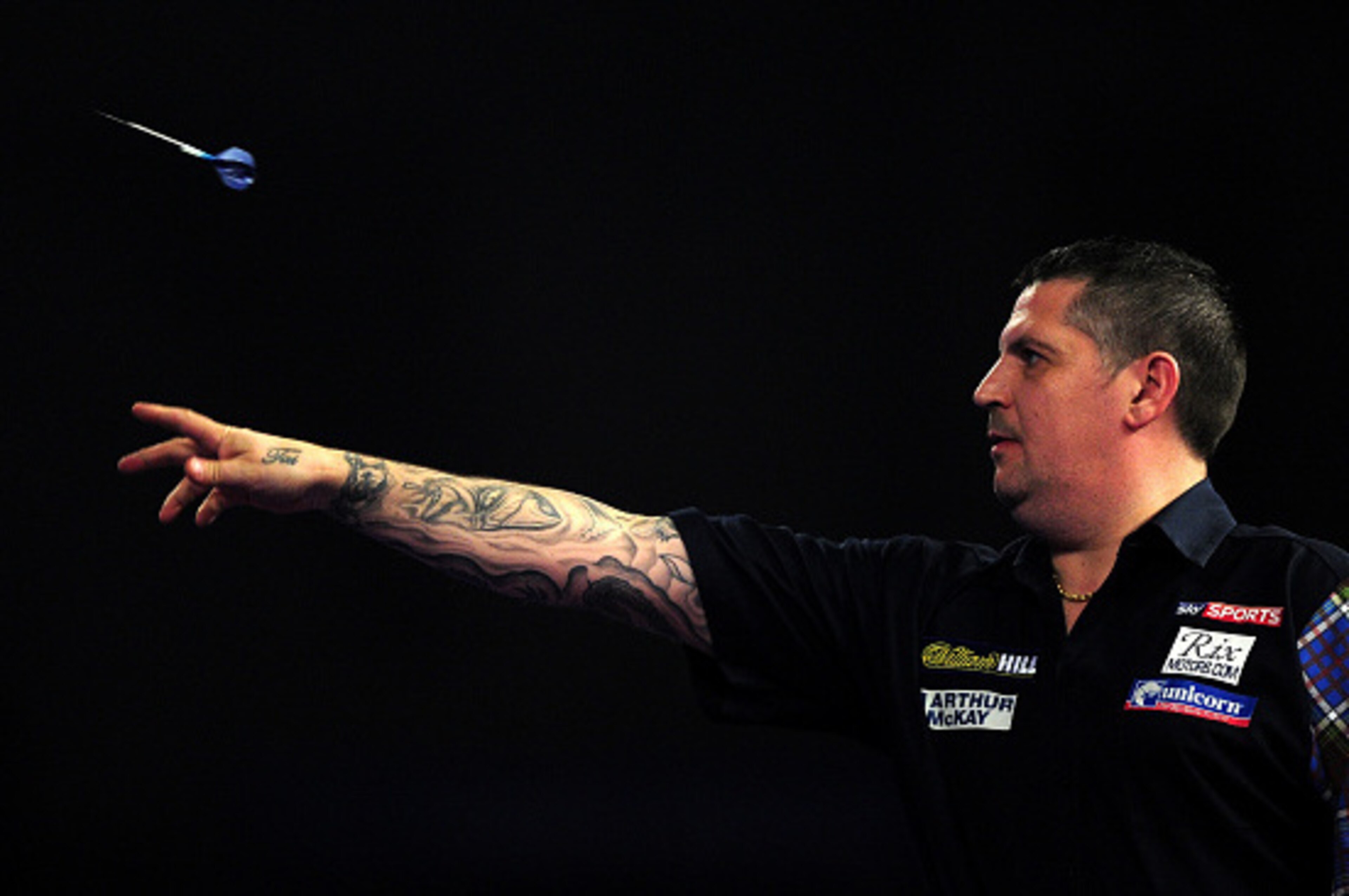 LONDON, ENGLAND - JANUARY 03:  Gary Anderson of Scotland throws during the final match against Adrian Lewis of England during Day Fifteen of the 2016 William Hill PDC World Darts Championships at Alexandra Palace on January 3, 2016 in London, England.  (P