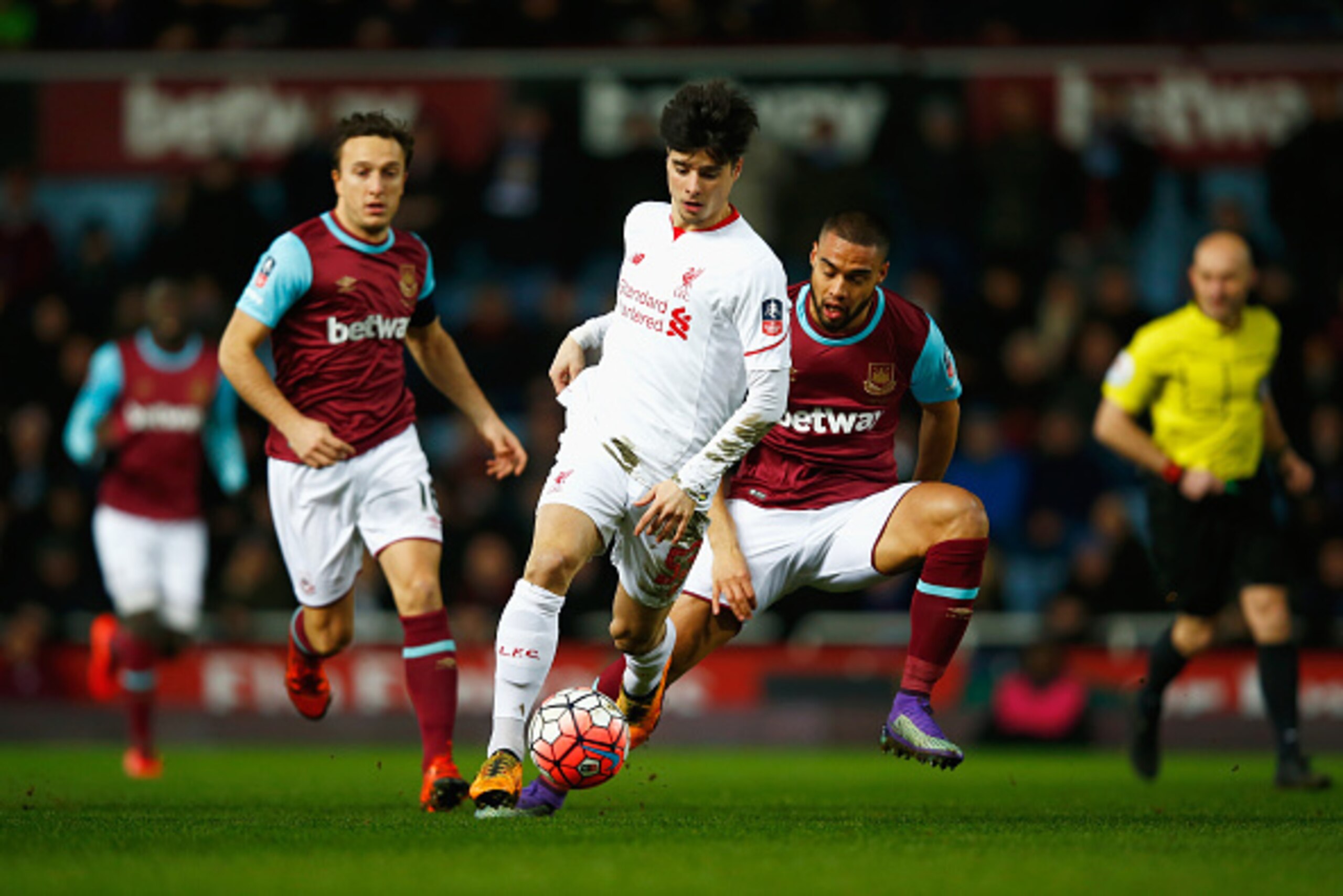 LONDON, ENGLAND - FEBRUARY 09: Joao Carlos Teixeira of Liverpool evades Mark Noble (L) and Winston Reid of West Ham United during the Emirates FA Cup Fourth Round Replay match between West Ham United and Liverpool at Boleyn Ground on February 9, 2016 in LONDON, ENGLAND - FEBRUARY 09: Joao Carlos Teixeira of Liverpool evades Mark Noble (L) and Winston Reid of West Ham United during the Emirates FA Cup Fourth Round Replay match between West Ham United and Liverpool at Boleyn Ground on February 9, 2016 in