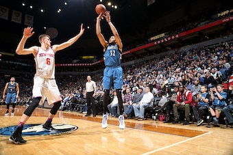 MINNEAPOLIS, MN -  FEBRUARY 20: Karl-Anthony Towns #32 of the Minnesota Timberwolves shoots the ball during the game against Kristaps Porzingis #6 of the New York Knicks on February 20, 2016 at Target Center in Minneapolis, Minnesota. NOTE TO USER: User e