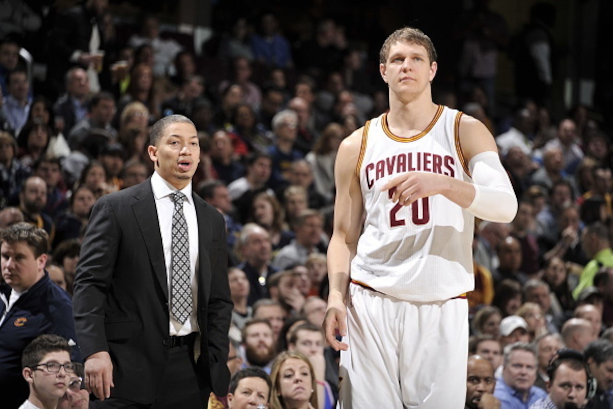 CLEVELAND, OH - FEBRUARY 22: Tyronn Lue is seen with Timofey Mozgov #20 of the Cleveland Cavaliers during the game against the Detroit Pistons on February 22, 2016 at Quicken Loans Arena in Cleveland, Ohio.  NOTE TO USER: User expressly acknowledges and a