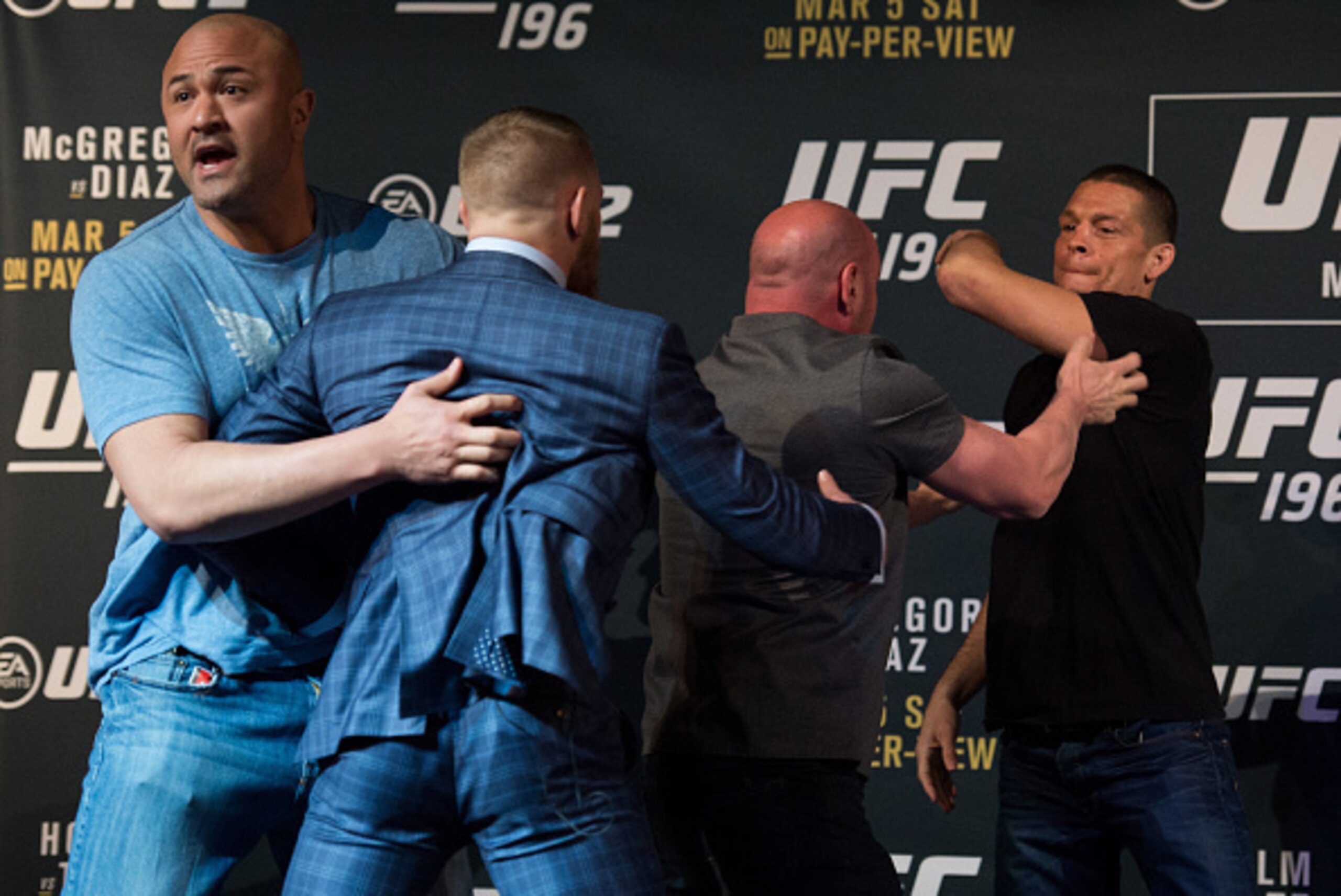 LAS VEGAS, NV - MARCH 3:   (L-R) UFC featherweight champion Conor McGregor and Nate Diaz are separated during the UFC 196 Press Conference at David Copperfield Theater in the MGM Grand Hotel/Casino on March 3, 2016 in Las Vegas, Nevada. (Photo by Brandon 