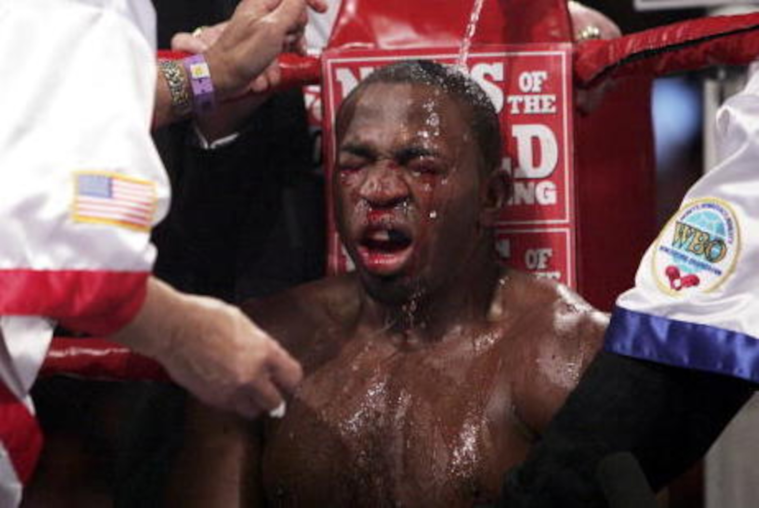 MANCHESTER, ENGLAND - MARCH 5:  Jeff Lacy is doused with water during the WBO and IBF super middleweight unification title fight against Joe Calzaghe at the MEN Arena on March 5, 2006 in Manchester, England.  (Photo by John Gichigi/Getty images)