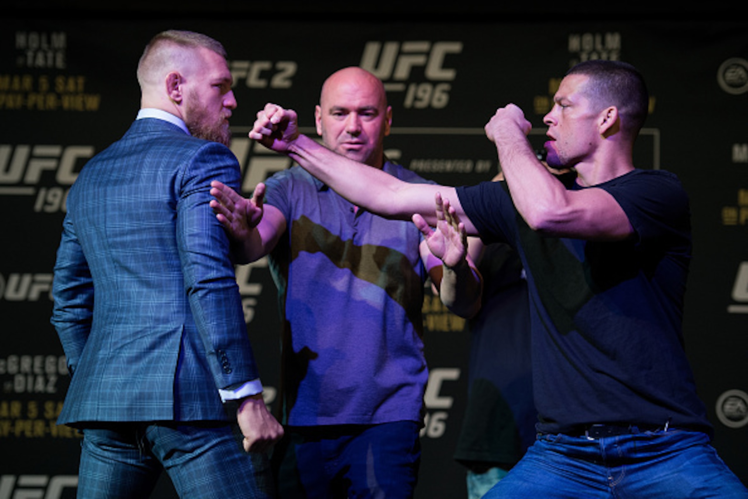 LAS VEGAS, NV - MARCH 3:   (L-R) UFC featherweight champion Conor McGregor and Nate Diaz face off during the UFC 196 Press Conference at David Copperfield Theater in the MGM Grand Hotel/Casino on March 3, 2016 in Las Vegas, Nevada. (Photo by Brandon Magnu