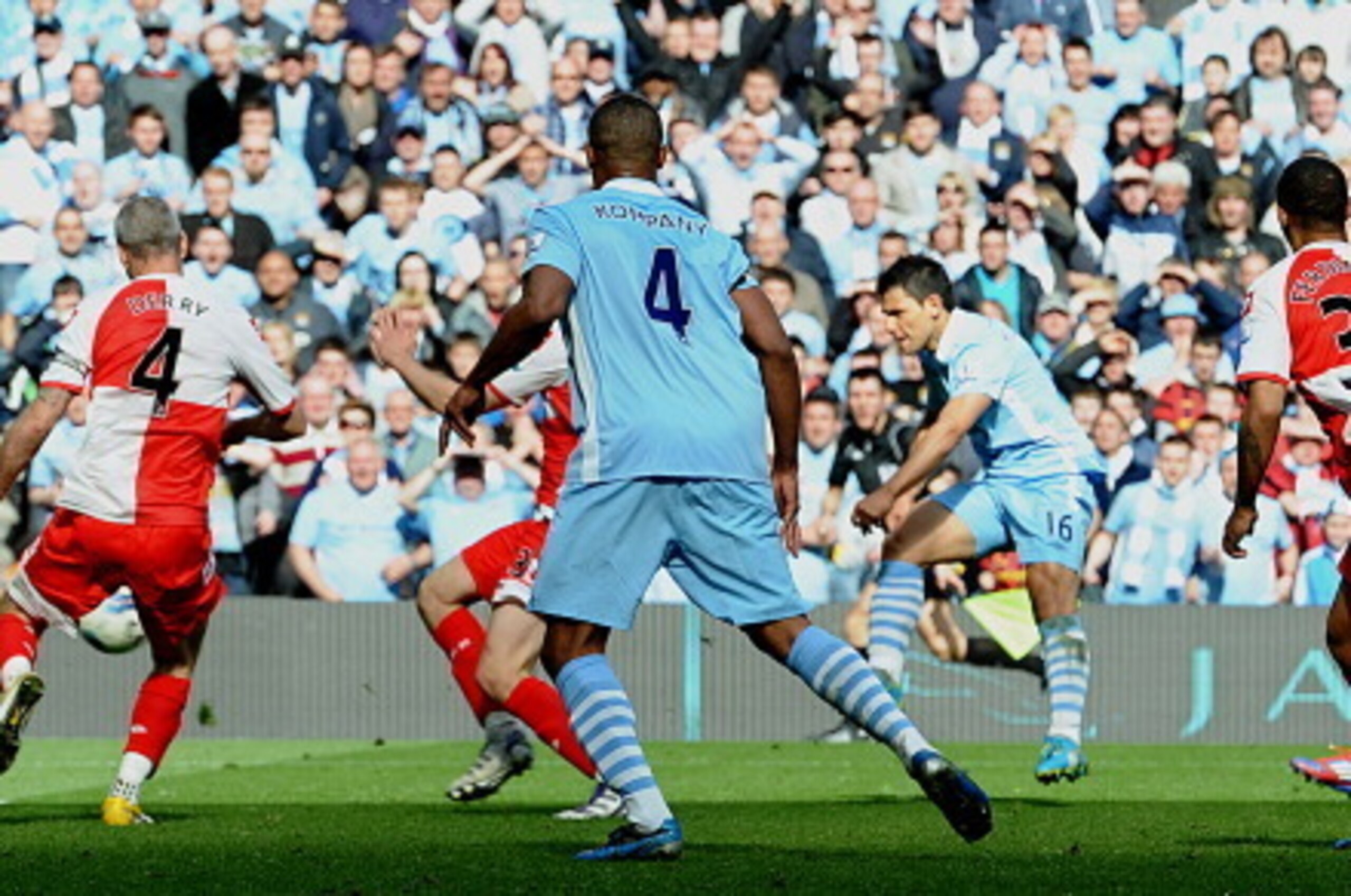 Manchester City's Argentinian striker Sergio Aguero (3rd R) scores their late winning goal during the English Premier League football match between Manchester City and Queens Park Rangers at The Etihad stadium in Manchester, north-west England on May 13, 
