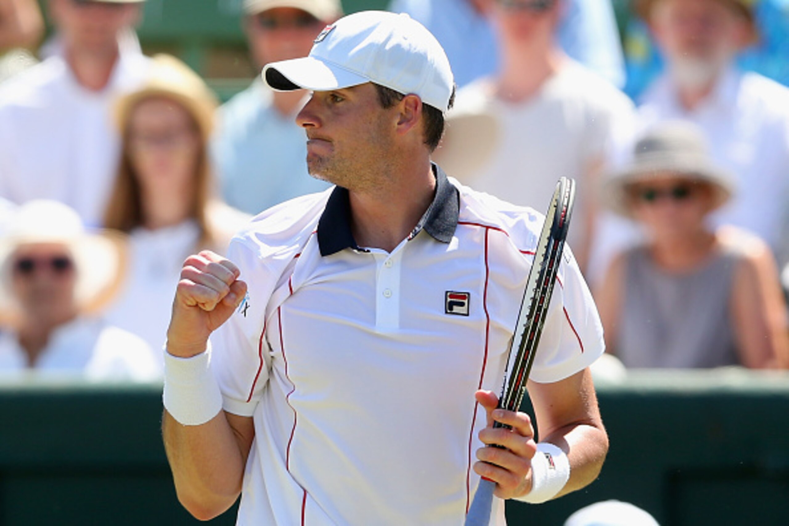 MELBOURNE, AUSTRALIA - MARCH 04:  John Isner of the United States celebrates winning match point in his match against Sam Groth of Australia during the Davis Cup tie between Australia and the United States at Kooyong on March 4, 2016 in Melbourne, Austral