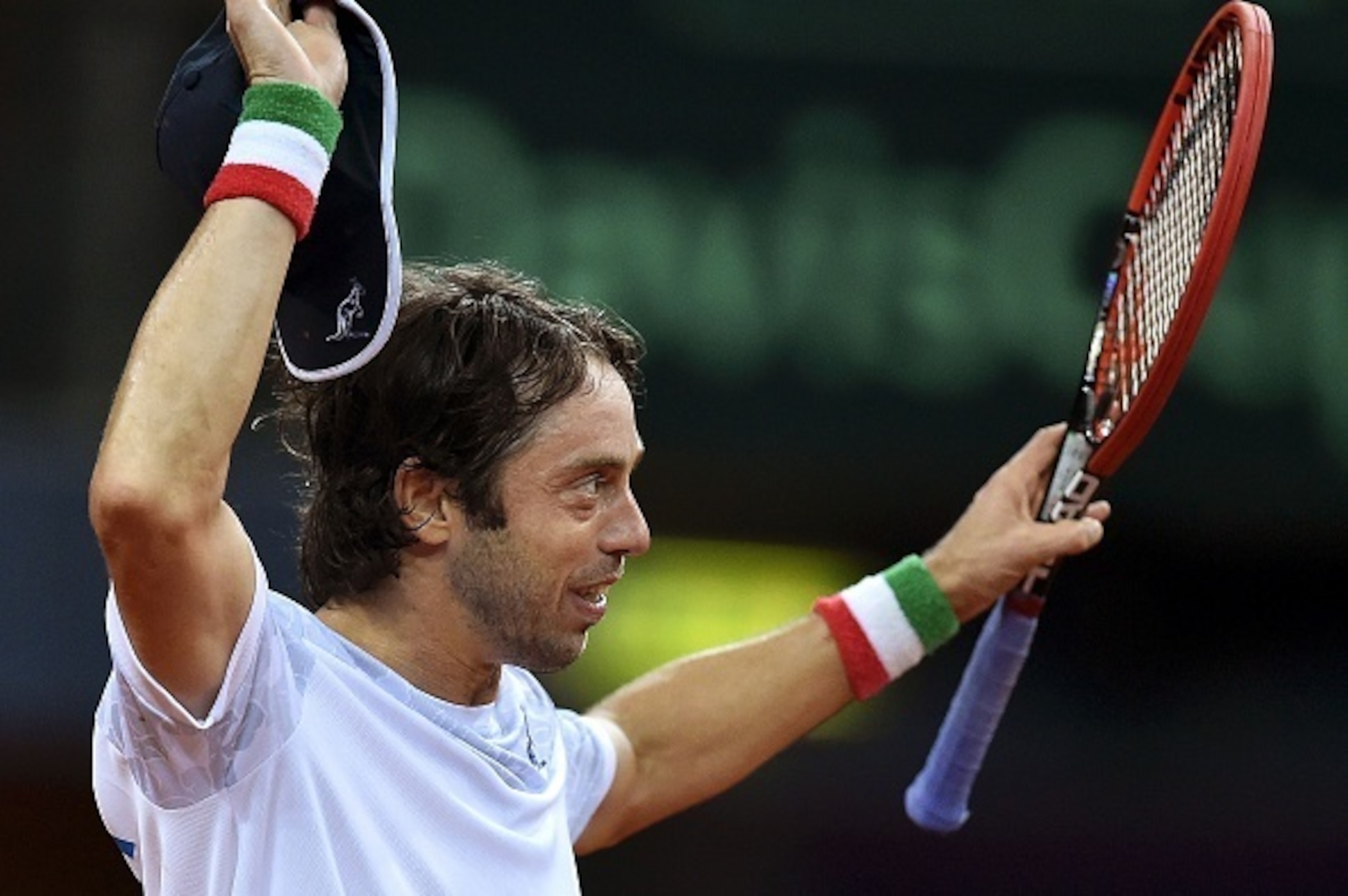 Italy's Paolo Lorenzi celebrates after defeating Switzerland's Marco Chiudinelli during the first day of the Davis Cup first Round World Group between Italy and Switzerland on March 4, 2016 at the Adriatic Arena in Pesaro. / AFP / ALBERTO PIZZOLI        (
