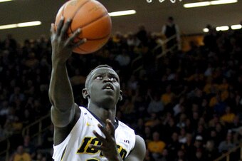 IOWA CITY, IA - MARCH 01:  Guard Peter Jok #14 of the Iowa Hawkeyes goes to the basket against OG Anunoby #3 of the Indiana Hoosiers, in the first half on March 1, 2016 at Carver-Hawkeye Arena, in Iowa City, Iowa.  (Photo by Matthew Holst/Getty Images)