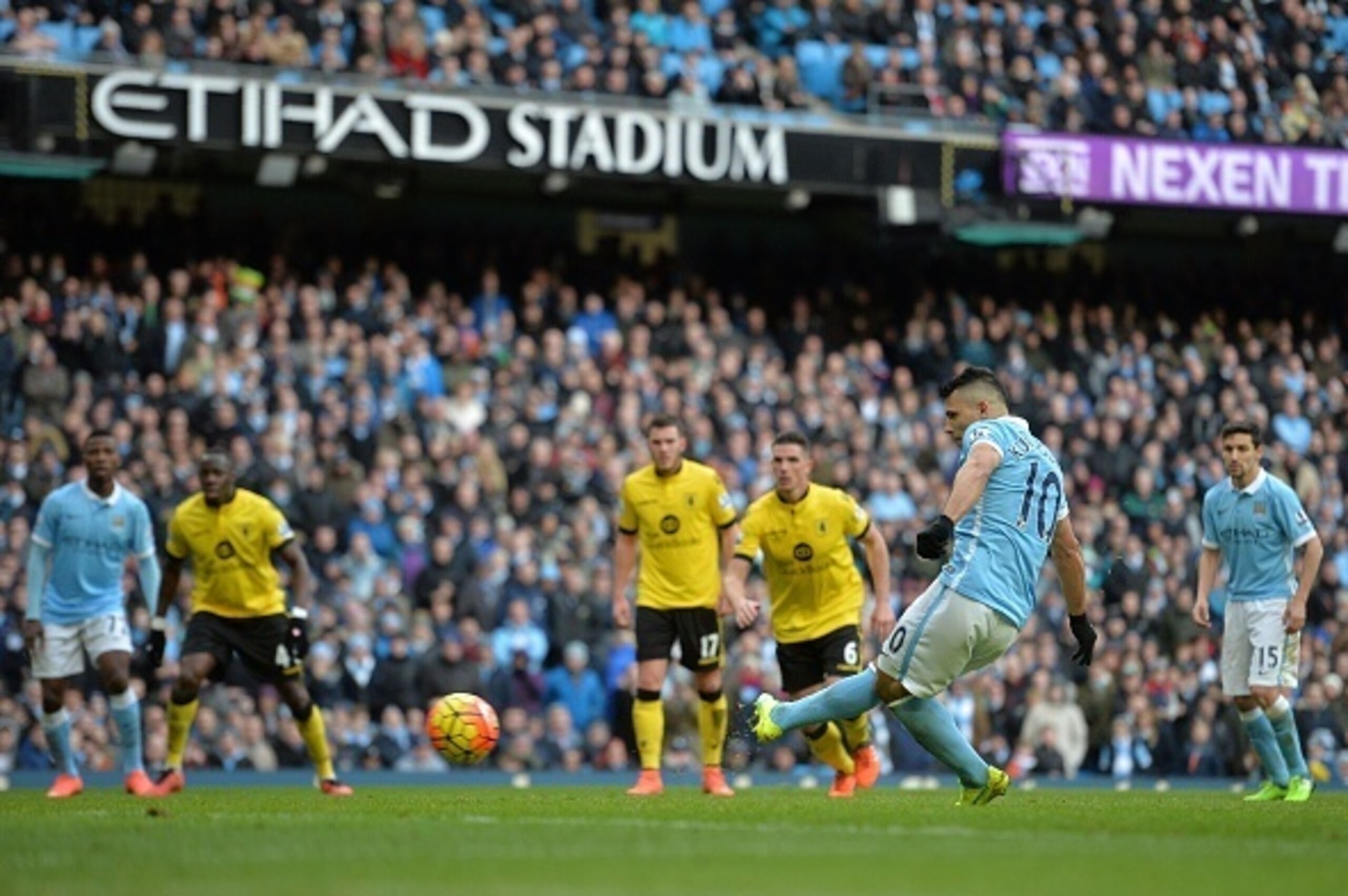 Manchester City's Argentinian striker Sergio Aguero (2R) shoots from the penalty sport but has his shot saved during the English Premier League football match between Manchester City and Aston Villa at the Etihad Stadium in Manchester, north west England,