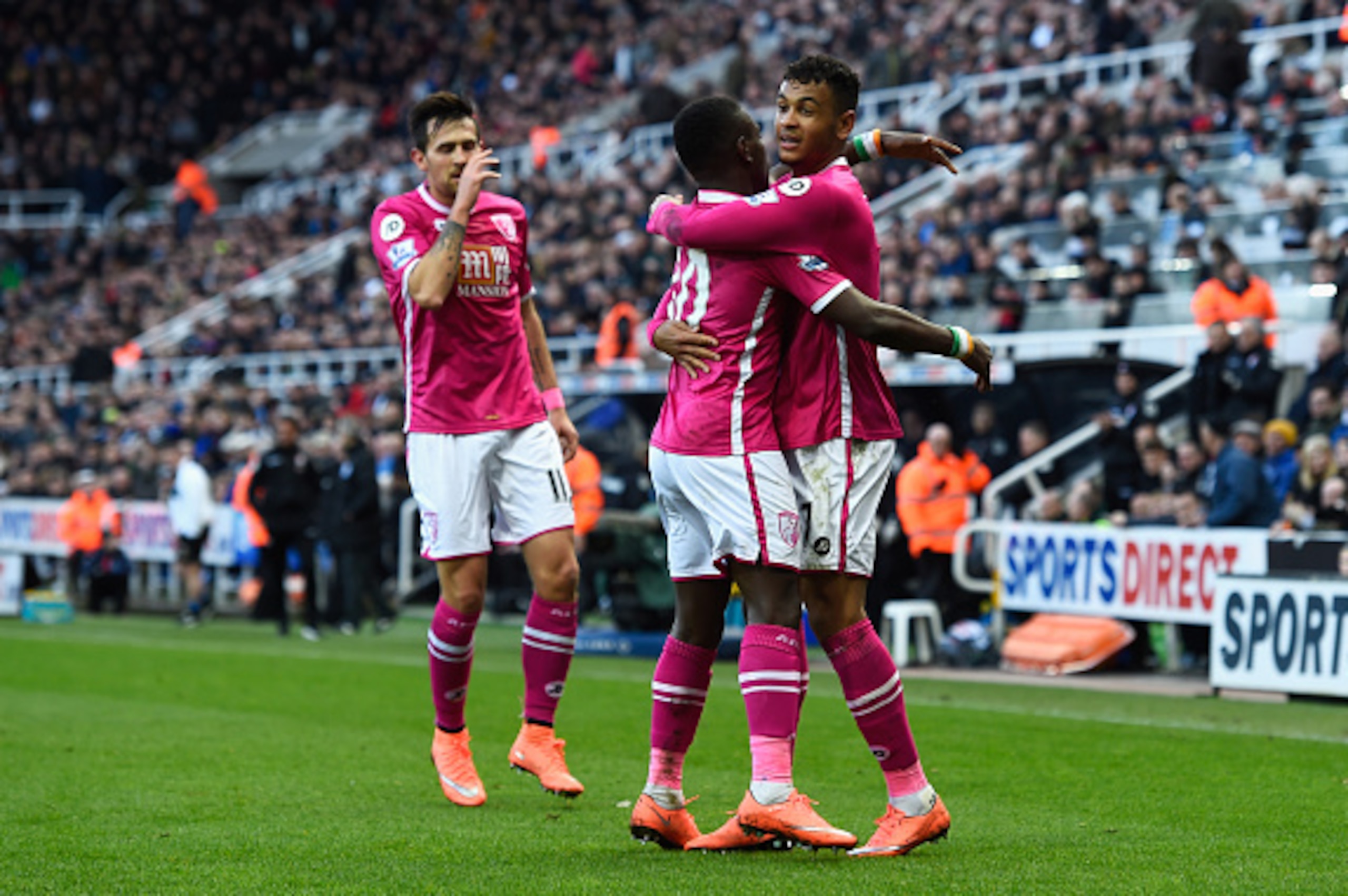 NEWCASTLE UPON TYNE, ENGLAND - MARCH 05:  Bournemouth players celebrate their first goal scored an own goal by Steven Taylor of Newcastle United during the Barclays Premier League match between Newcastle United and A.F.C. Bournemouth at St James' Park on 