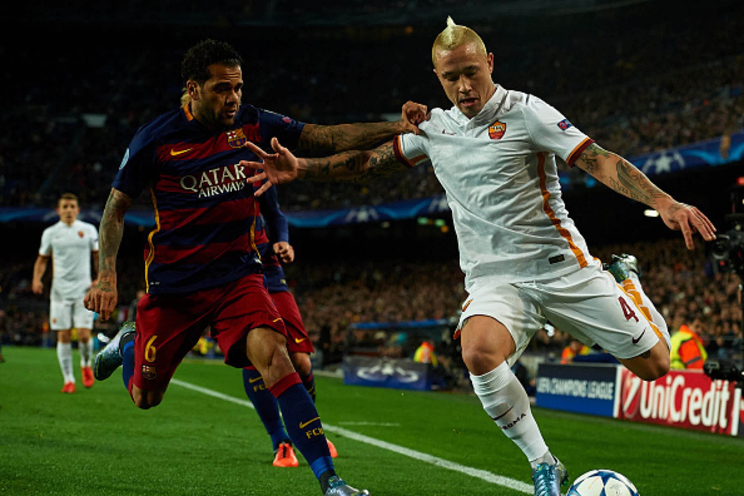 BARCELONA, SPAIN - NOVEMBER 24: Daniel Alves (6) of Barcelona competes for the ball with Radja Nainggolan of Roma during the UEFA Champions League Group E match between FC Barcelona and AS Roma at Camp Nou on November 24, 2015 in Barcelona, Spain. (Phot BARCELONA, SPAIN - NOVEMBER 24: Daniel Alves (6) of Barcelona competes for the ball with Radja Nainggolan of Roma during the UEFA Champions League Group E match between FC Barcelona and AS Roma at Camp Nou on November 24, 2015 in Barcelona, Spain. (Phot