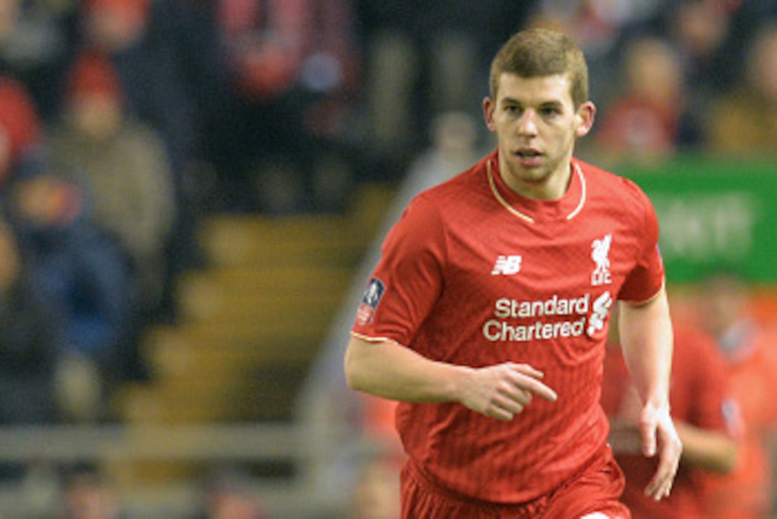 Liverpool's English defender Jon Flanagan chases the ball during the English FA Cup third round replay football match between Liverpool and Exeter City at Anfield in Liverpool, north west England on January 20, 2016. AFP PHOTO / PAUL ELLIS

RESTRICTED TO 