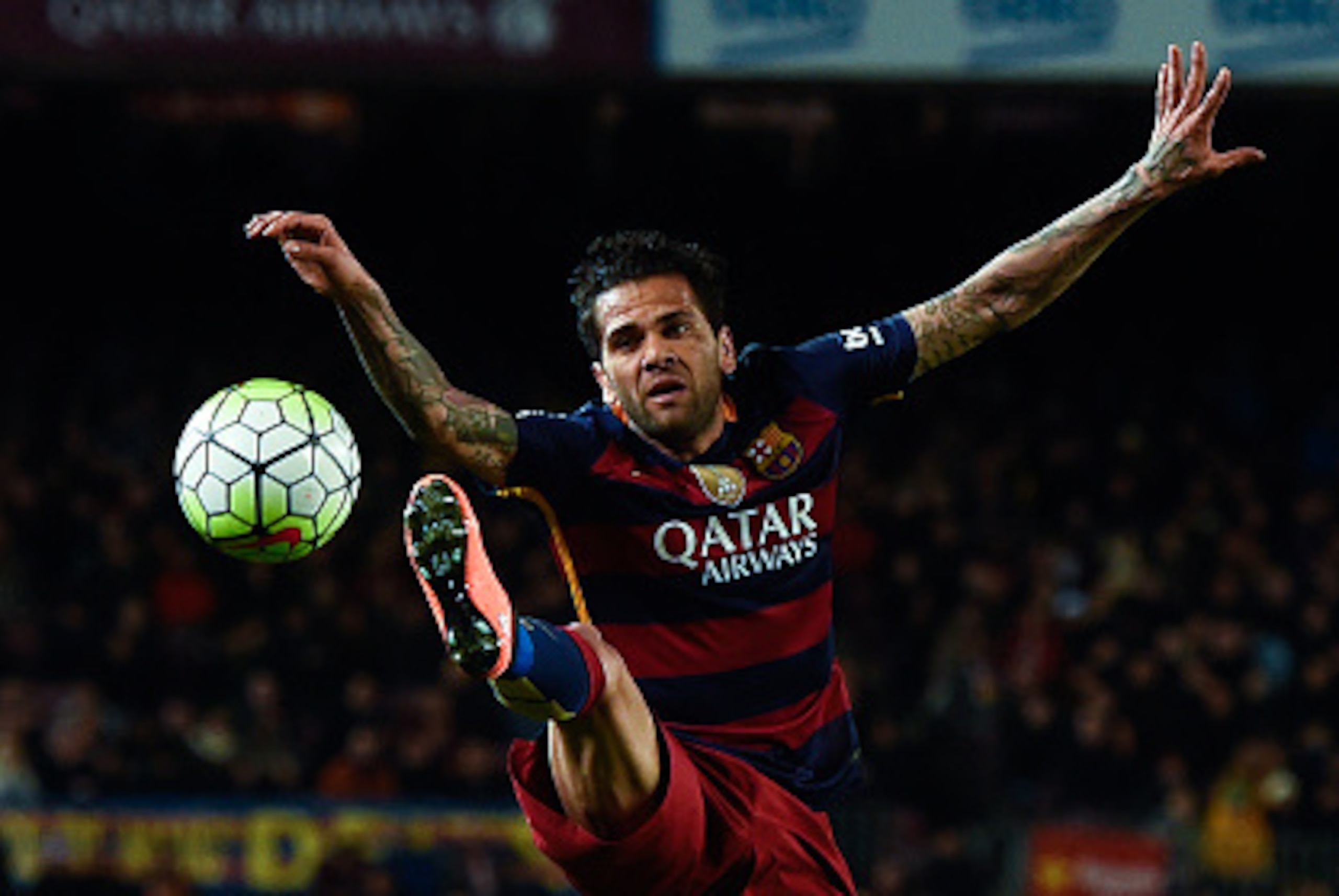 BARCELONA, SPAIN - FEBRUARY 28:  Dani Alves of FC Barcelona jumps to control the ball during the La Liga match between FC Barcelona and Sevilla FC at Camp Nou on February 28, 2016 in Barcelona, Spain.  (Photo by David Ramos/Getty Images)