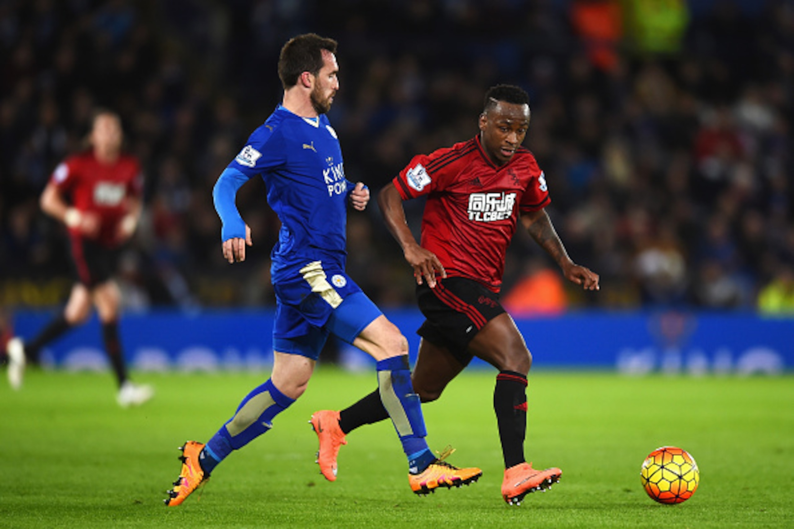 LEICESTER, ENGLAND - MARCH 01:  Saido Berahino of West Bromwich Albion and Christian Fuchs of Leicester City compete for the ball during the Barclays Premier League match between Leicester City and West Bromwich Albion at The King Power Stadium on March 1