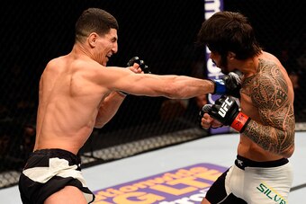 LAS VEGAS, NV - MARCH 05: (L-R) Nordine Taleb of France punches Erick Silva of Brazil in their welterweight bout during the UFC 196 event inside MGM Grand Garden Arena on March 5, 2016 in Las Vegas, Nevada.  (Photo by Josh Hedges/Zuffa LLC/Zuffa LLC via G