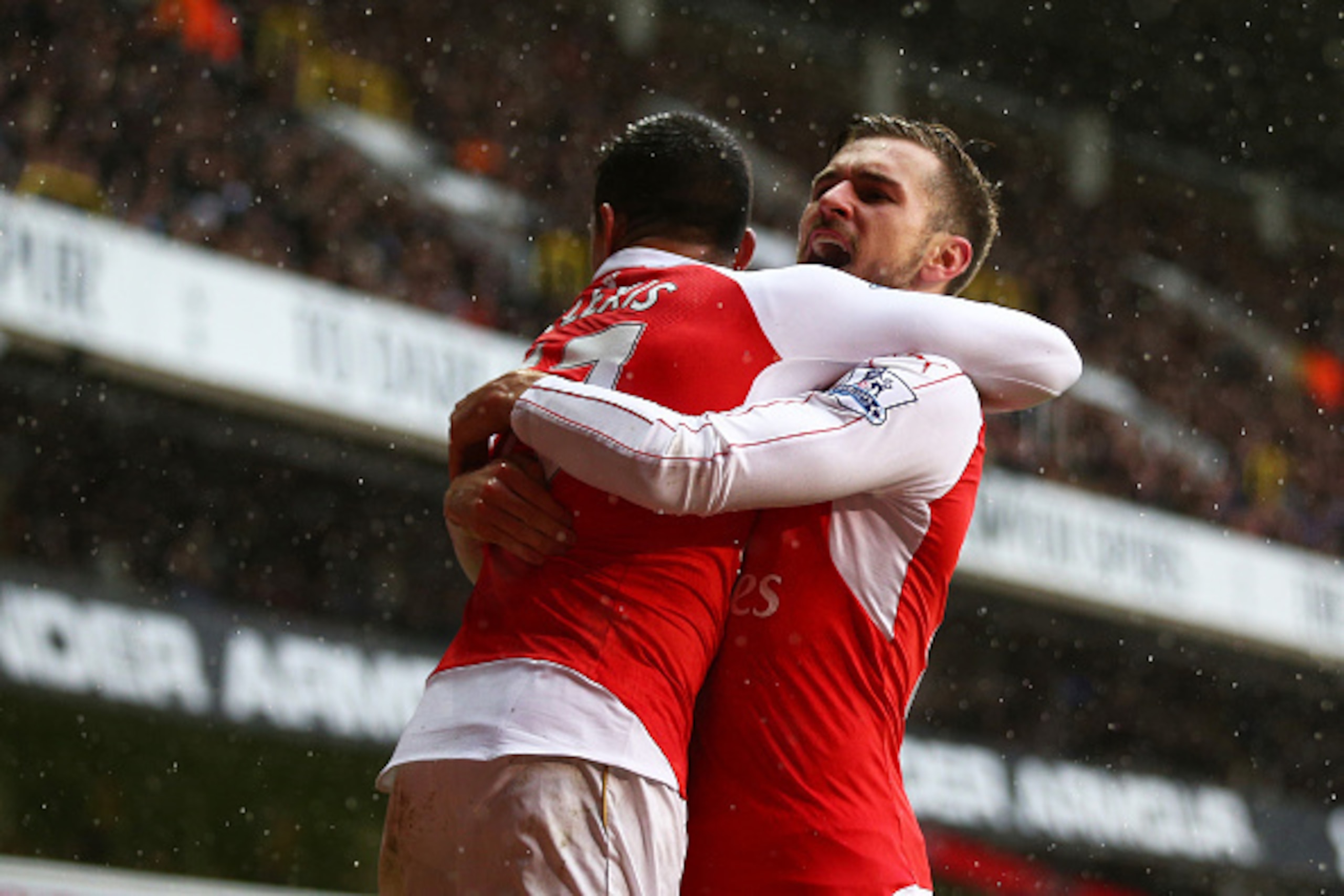 LONDON, ENGLAND - MARCH 05:  Alexis Sanchez (L) of Arsenal celebrates scoring his team's second goal with his team mate Aaron Ramsey (R) during the Barclays Premier League match between Tottenham Hotspur and Arsenal at White Hart Lane on March 5, 2016 in 