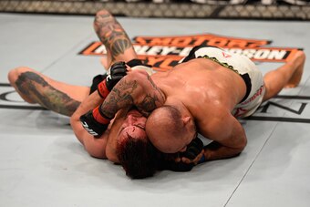 LAS VEGAS, NV - MARCH 05: (R-L) Siyar Bahadurzada of Afghanistan attempts to submit Brandon Thatch in their welterweight bout during the UFC 196 event inside MGM Grand Garden Arena on March 5, 2016 in Las Vegas, Nevada.  (Photo by Josh Hedges/Zuffa LLC/Zu