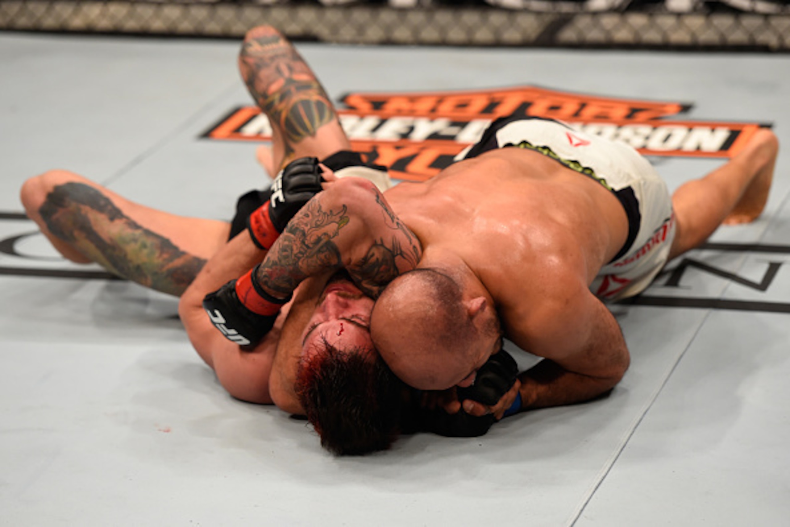 LAS VEGAS, NV - MARCH 05: (R-L) Siyar Bahadurzada of Afghanistan attempts to submit Brandon Thatch in their welterweight bout during the UFC 196 event inside MGM Grand Garden Arena on March 5, 2016 in Las Vegas, Nevada.  (Photo by Josh Hedges/Zuffa LLC/Zu