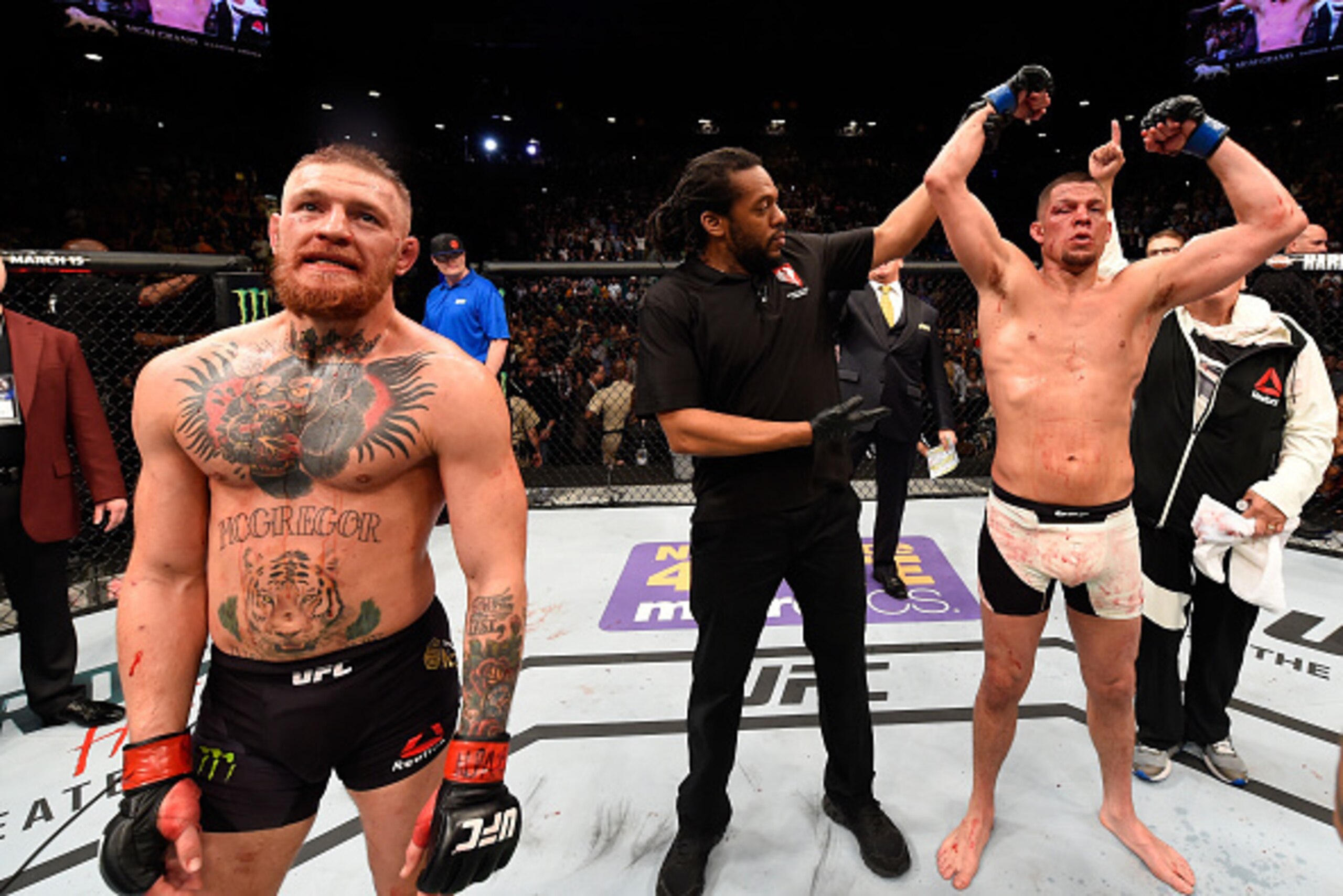 LAS VEGAS, NV - MARCH 05:  Nate Diaz (right) reacts to his victory over Conor McGregor of Ireland (left) in their welterweight bout during the UFC 196 event inside MGM Grand Garden Arena on March 5, 2016 in Las Vegas, Nevada.  (Photo by Josh Hedges/Zuffa 