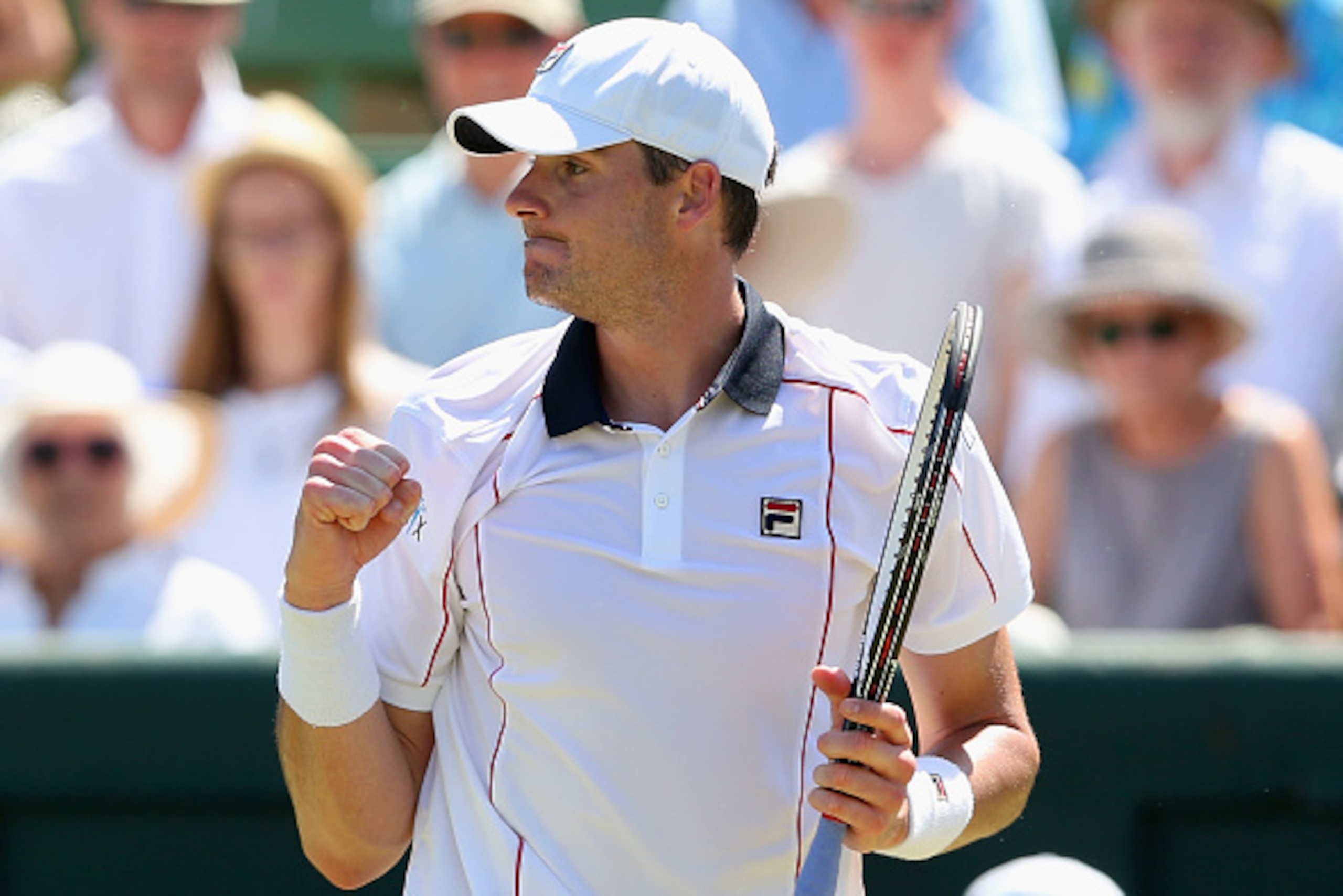 MELBOURNE, AUSTRALIA - MARCH 04:  John Isner of the United States celebrates winning match point in his match against Sam Groth of Australia during the Davis Cup tie between Australia and the United States at Kooyong on March 4, 2016 in Melbourne, Austral