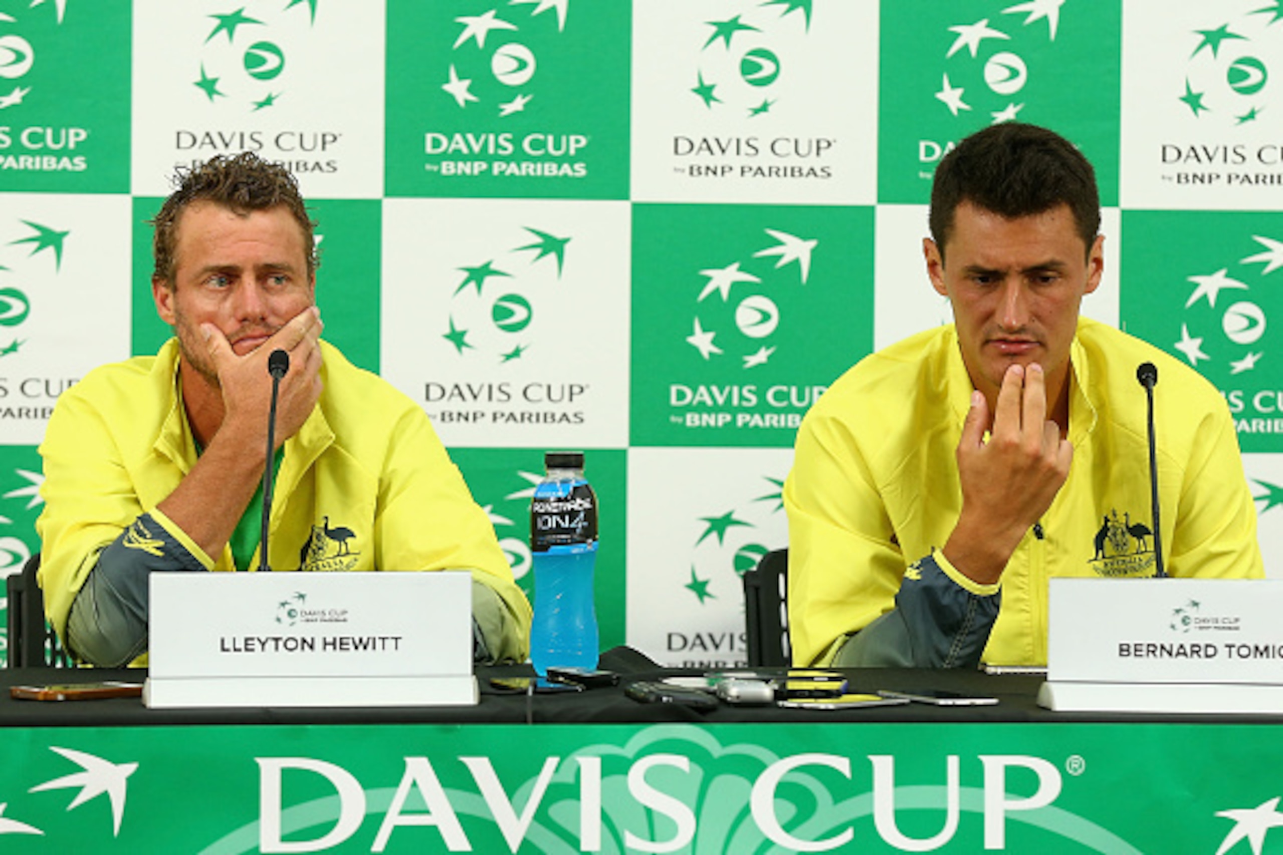 MELBOURNE, AUSTRALIA - MARCH 06:  Lleyton Hewitt captain of Australia and Bernard Tomic of Australia speak to media after the Men's singles match during the Davis Cup tie between Australia and the United States at Kooyong on March 6, 2016 in Melbourne, Au
