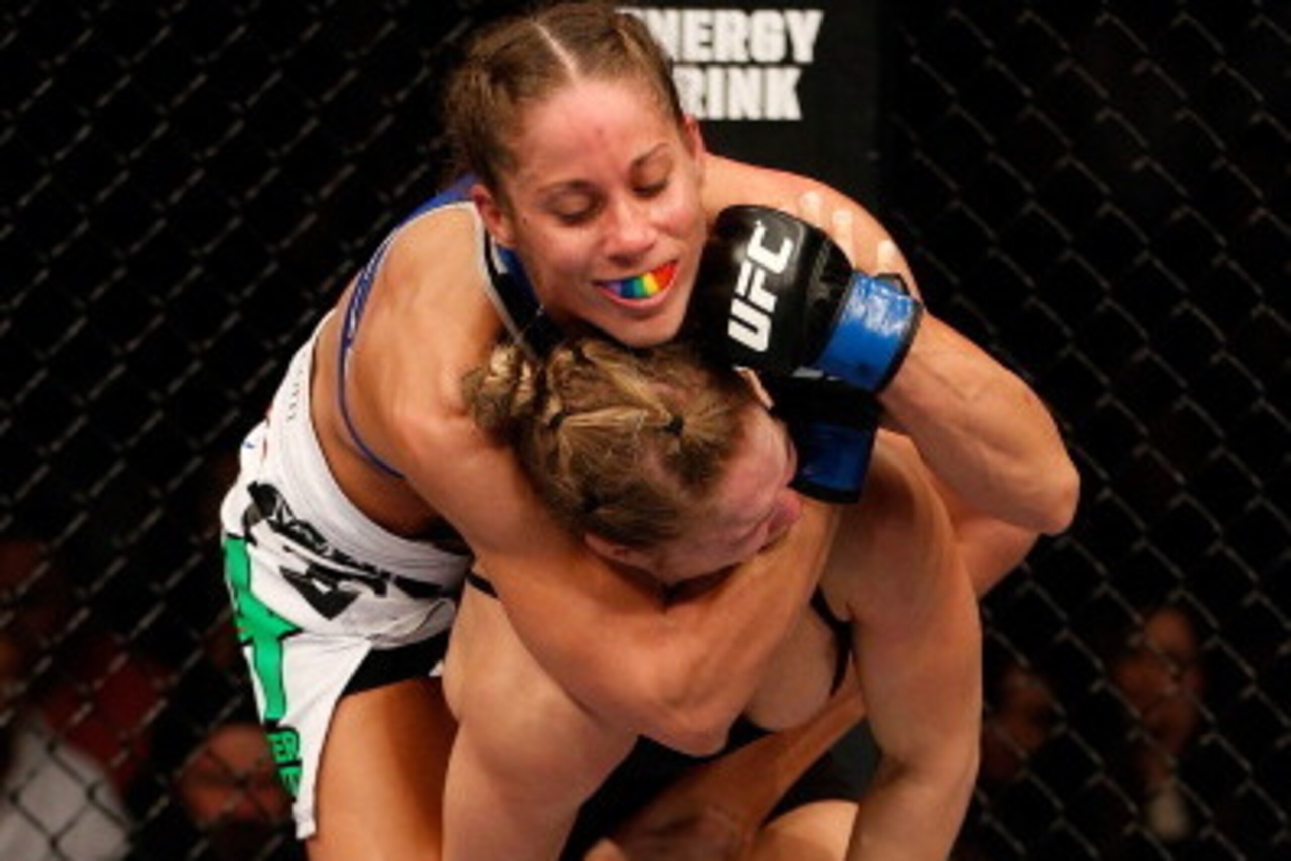 ANAHEIM, CA - FEBRUARY 23:  (L-R) Liz Carmouche applies a neck crank against Ronda Rousey in their women's bantamweight title fight during UFC 157 at Honda Center on February 23, 2013 in Anaheim, California.  (Photo by Josh Hedges/Zuffa LLC/Zuffa LLC via 