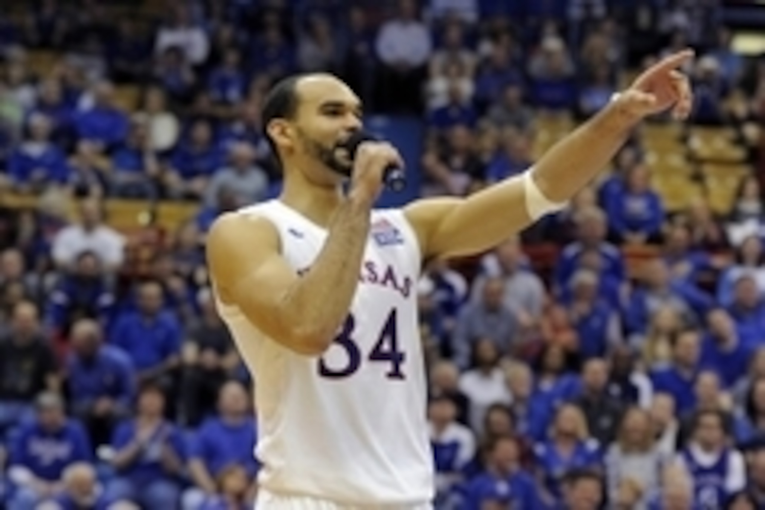 Mar 5, 2016; Lawrence, KS, USA; Kansas Jayhawks forward Perry Ellis (34) talks to the crowd after the senior game against the Iowa State Cyclones at Allen Fieldhouse. Kansas won the game 85-78. Mandatory Credit: John Rieger-USA TODAY Sports