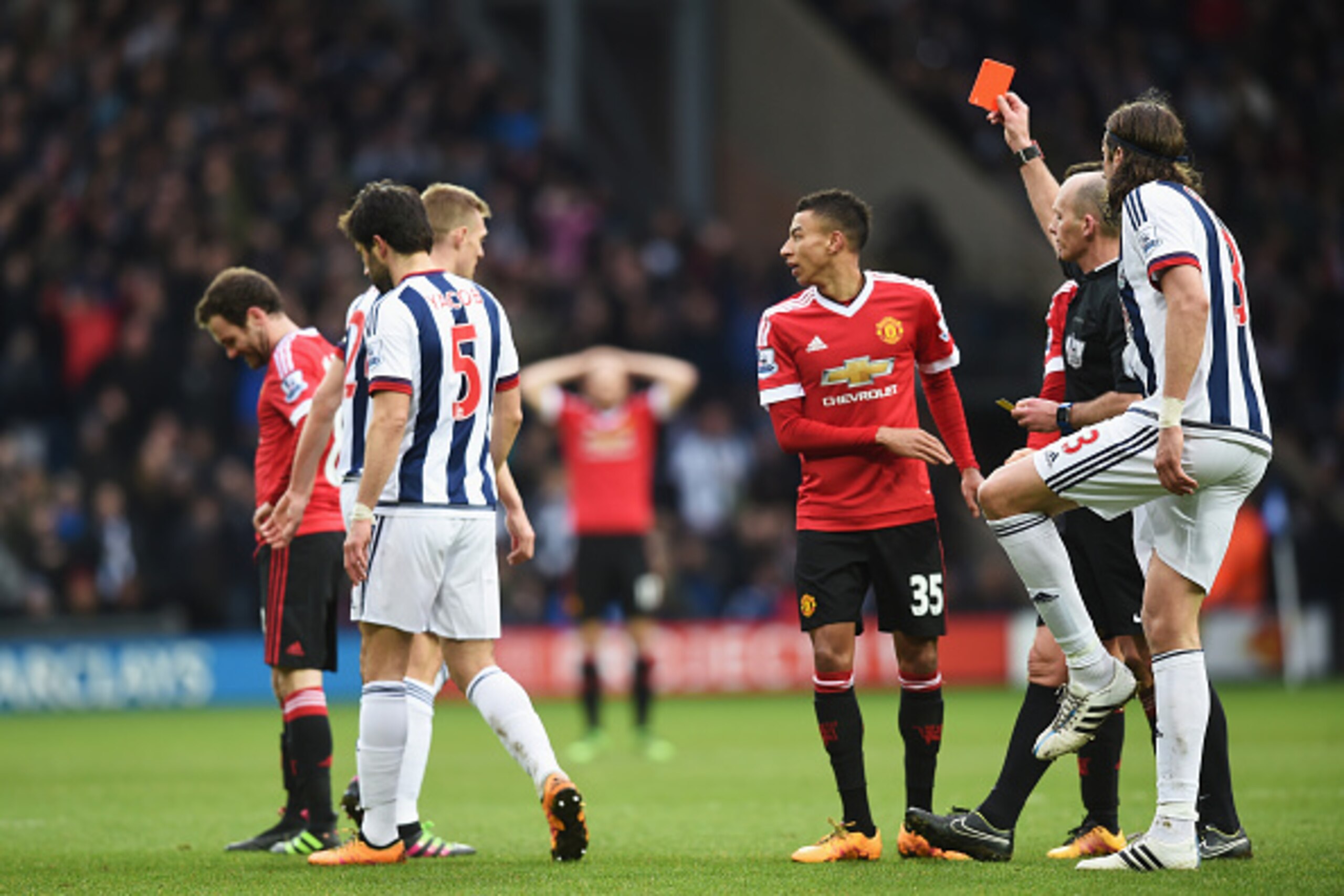 WEST BROMWICH, ENGLAND - MARCH 06: Referee Mike Dean shows the red card to Juan Mata of Manchester United during the Barclays Premier League match between West Bromwich Albion and Manchester United at The Hawthorns on March 6, 2016 in West Bromwich, Engla