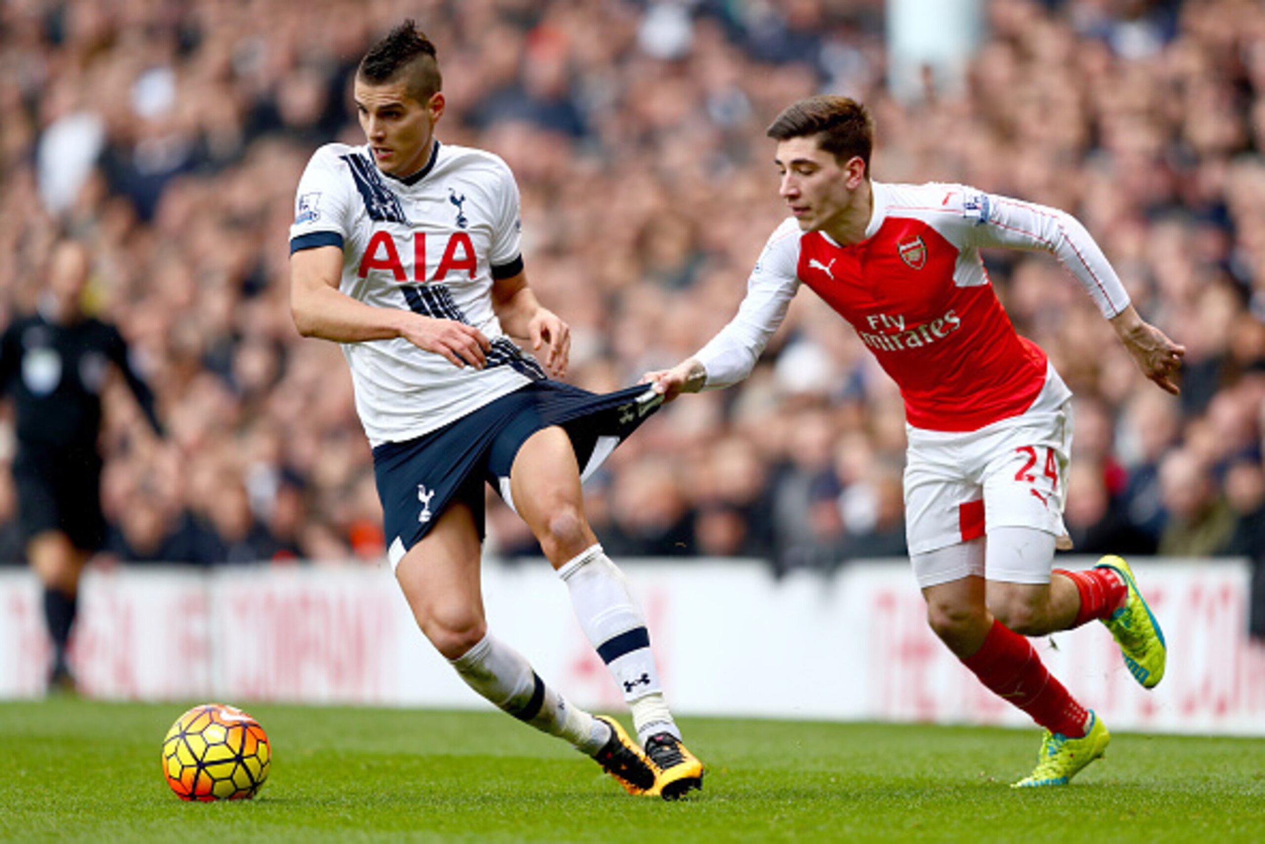 LONDON, ENGLAND - MARCH 05:  Erik Lamela of Tottenham Hotspur has his shorts pulled by Hector Bellerin of Arsenal during the Barclays Premier League match between Tottenham Hotspur and Arsenal at White Hart Lane on March 5, 2016 in London, England.  (Phot