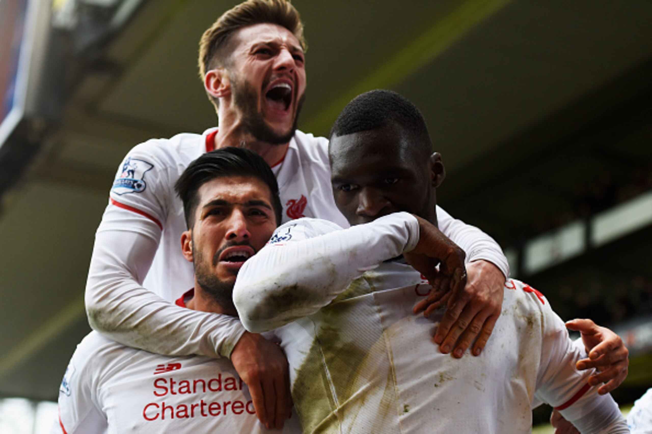 LONDON, ENGLAND - MARCH 06:  Christian Benteke of Liverpool (R) celebrates with team mates Emre Can and Adam Lallana as he scores their second goal from the penalty spot during the Barclays Premier League match between Crystal Palace and Liverpool at Selh