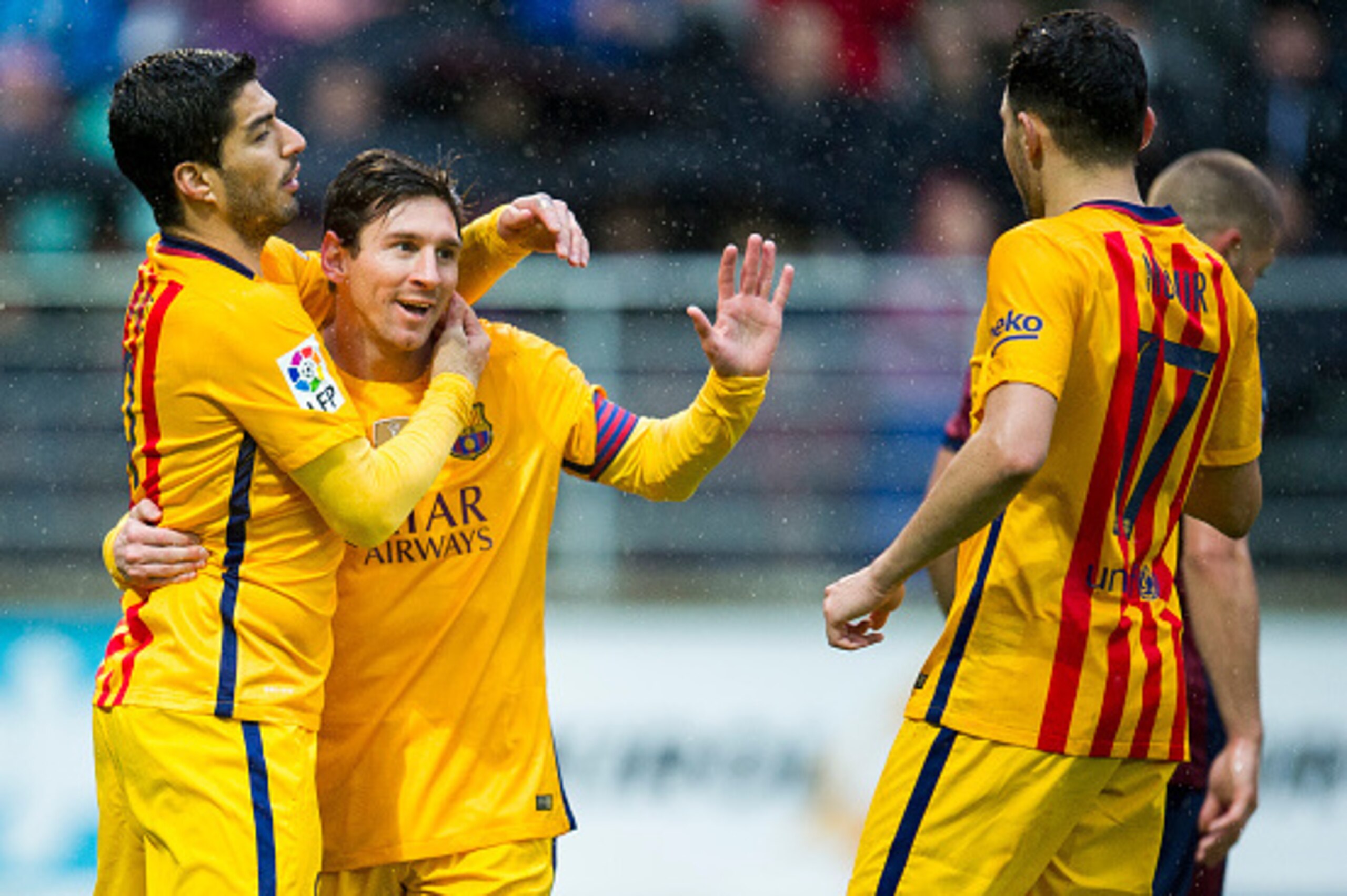 EIBAR, SPAIN - MARCH 06:  Lionel Messi of FC Barcelona celebrates with his teammates Luis Suarez and Munir El Haddadi of FC Barcelona after scoring his team's third goal during the La Liga match between SD Eibar and FC Barcelona at Ipurua Municipal Stadiu