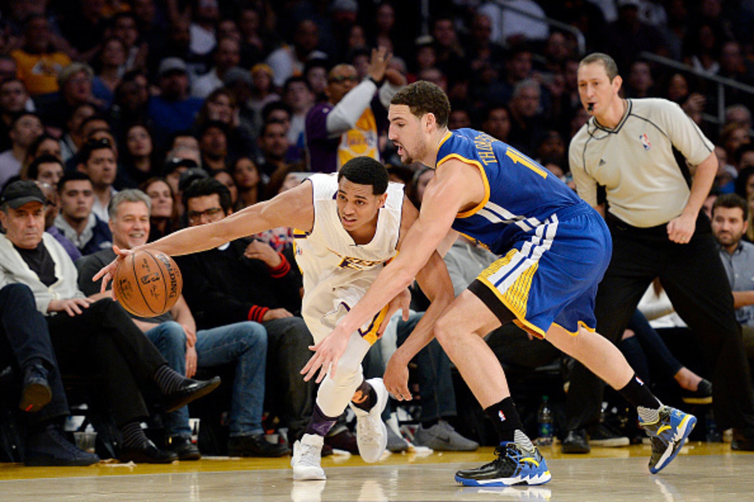 LOS ANGELES, CA - MARCH 6: Jordan Clarkson #6 of the Los Angeles Lakers breaks away from Klay Thompson #11 of the Golden State Warriors during the second half of the basketball game at Staples Center March 6, 2016, in Los Angeles, California. NOTE TO USER