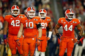 GLENDALE, AZ - JANUARY 11:  Christian Wilkins #42, Ben Boulware #10, Austin Bryant #91 and B.J. Goodson #44  of the Clemson Tigers look on against the Alabama Crimson Tide during the 2016 College Football Playoff National Championship Game at University o