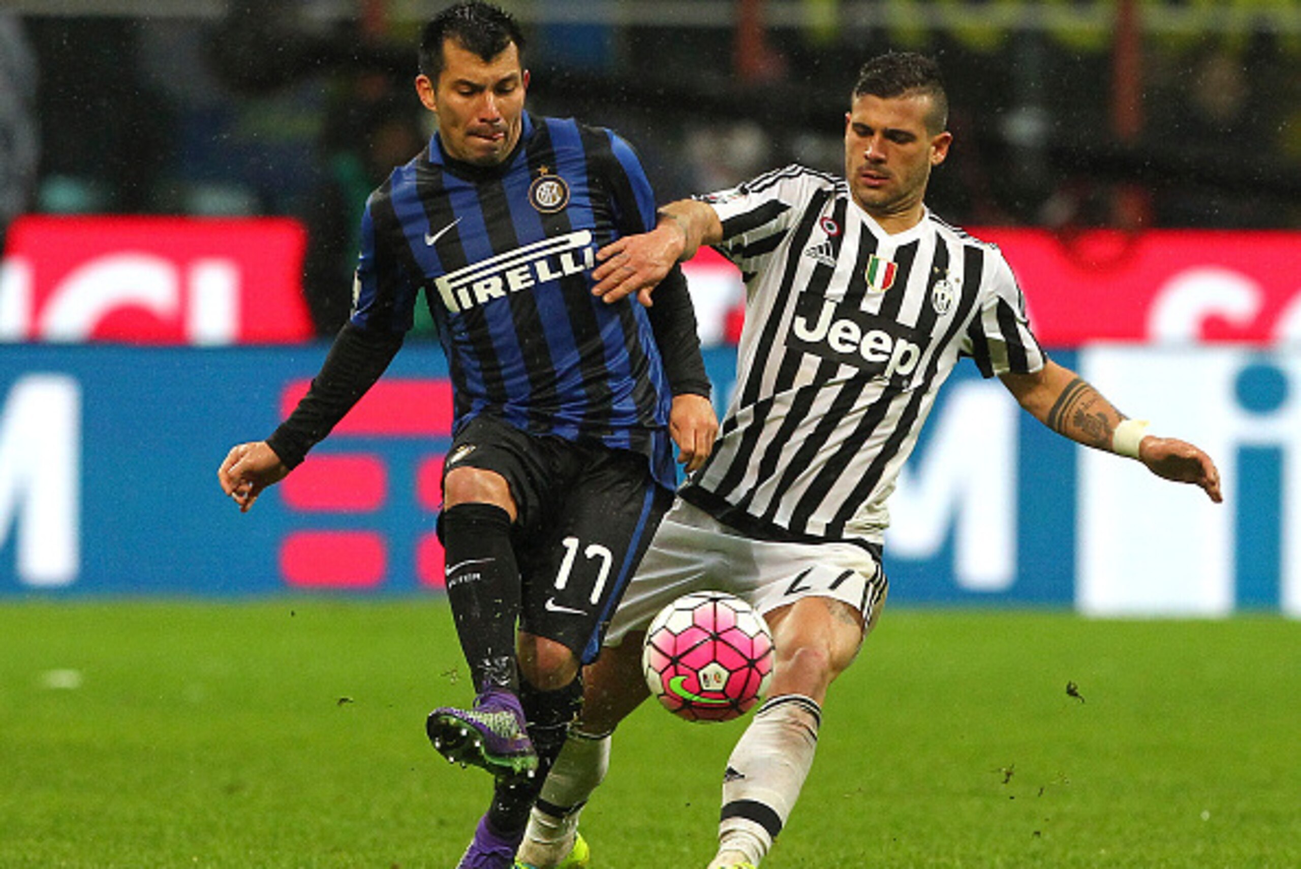 MILAN, ITALY - MARCH 02:  Gary Alexis Medel of FC Internazionale Milano is challenged by Stefano Sturaro of Juventus FC during the TIM Cup match between FC Internazionale Milano and Juventus FC at Stadio Giuseppe Meazza on March 2, 2016 in Milan, Italy.  