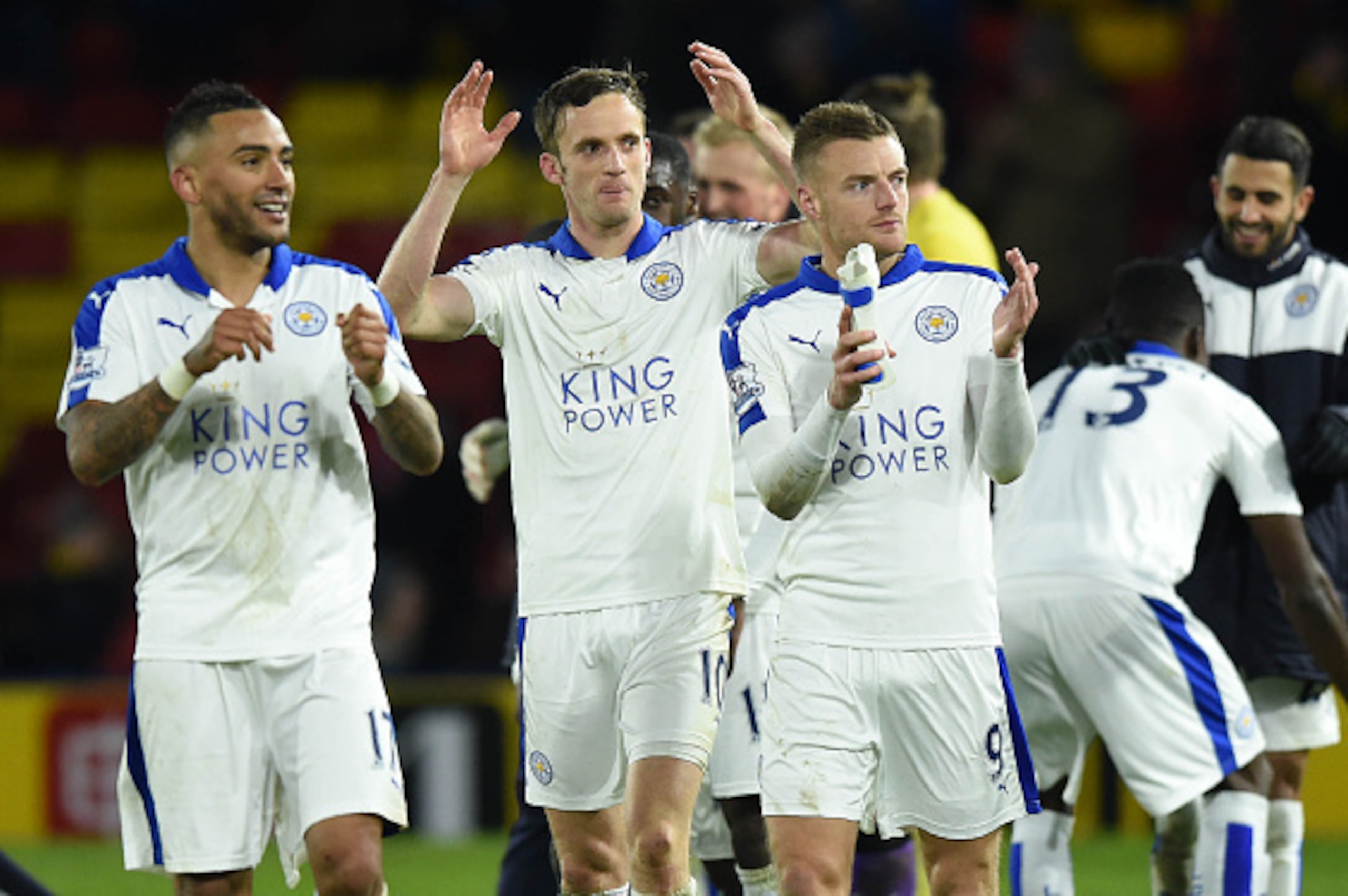 Leicester City's English defender Danny Simpson (L), Leicester City's Welsh midfielder Andy King (C) and Leicester City's English striker Jamie Vardy appluad the fans following the English Premier League football match between Watford and Leicester City a