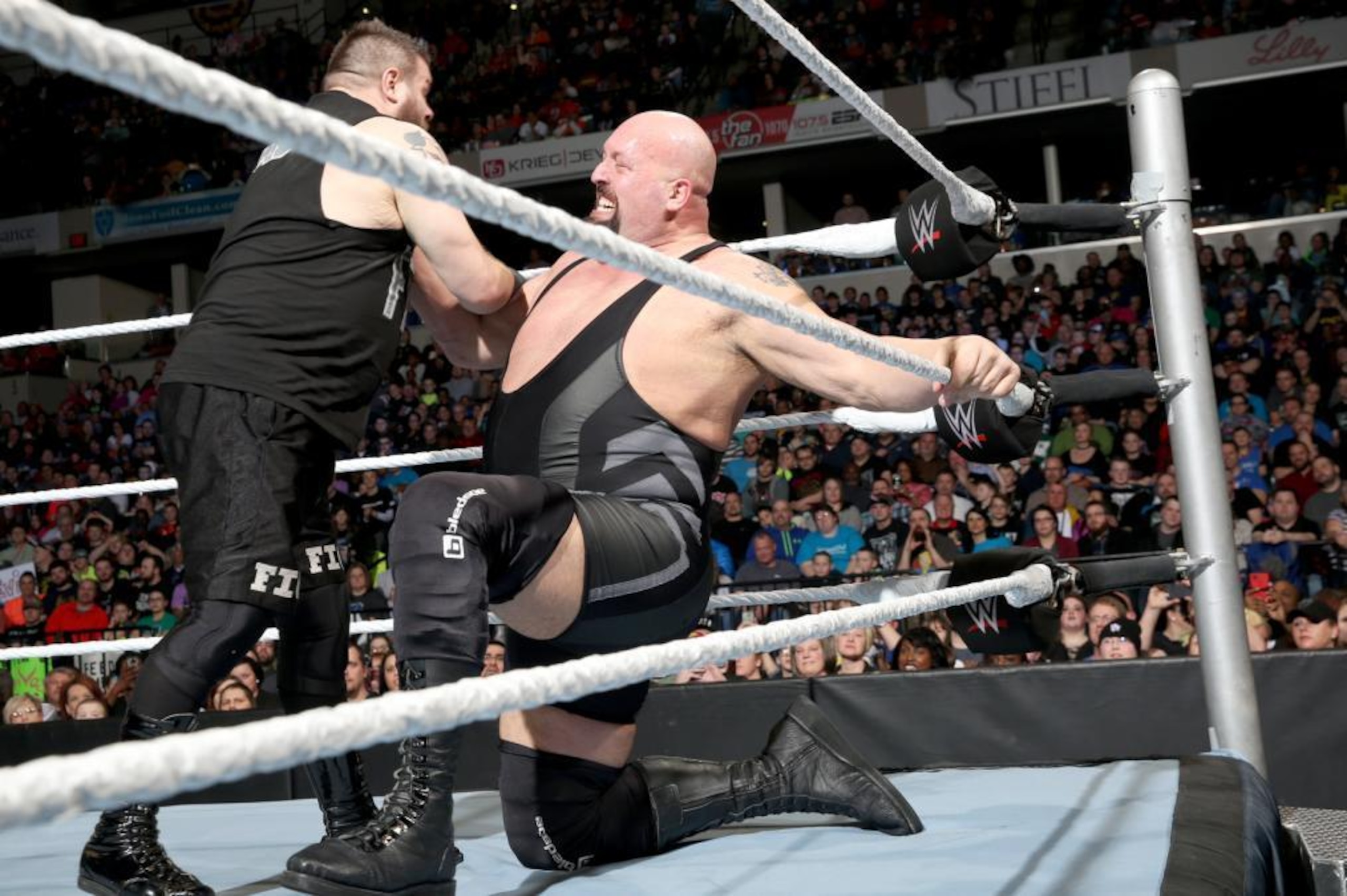 Big Show grabs hold of Kevin Owens.