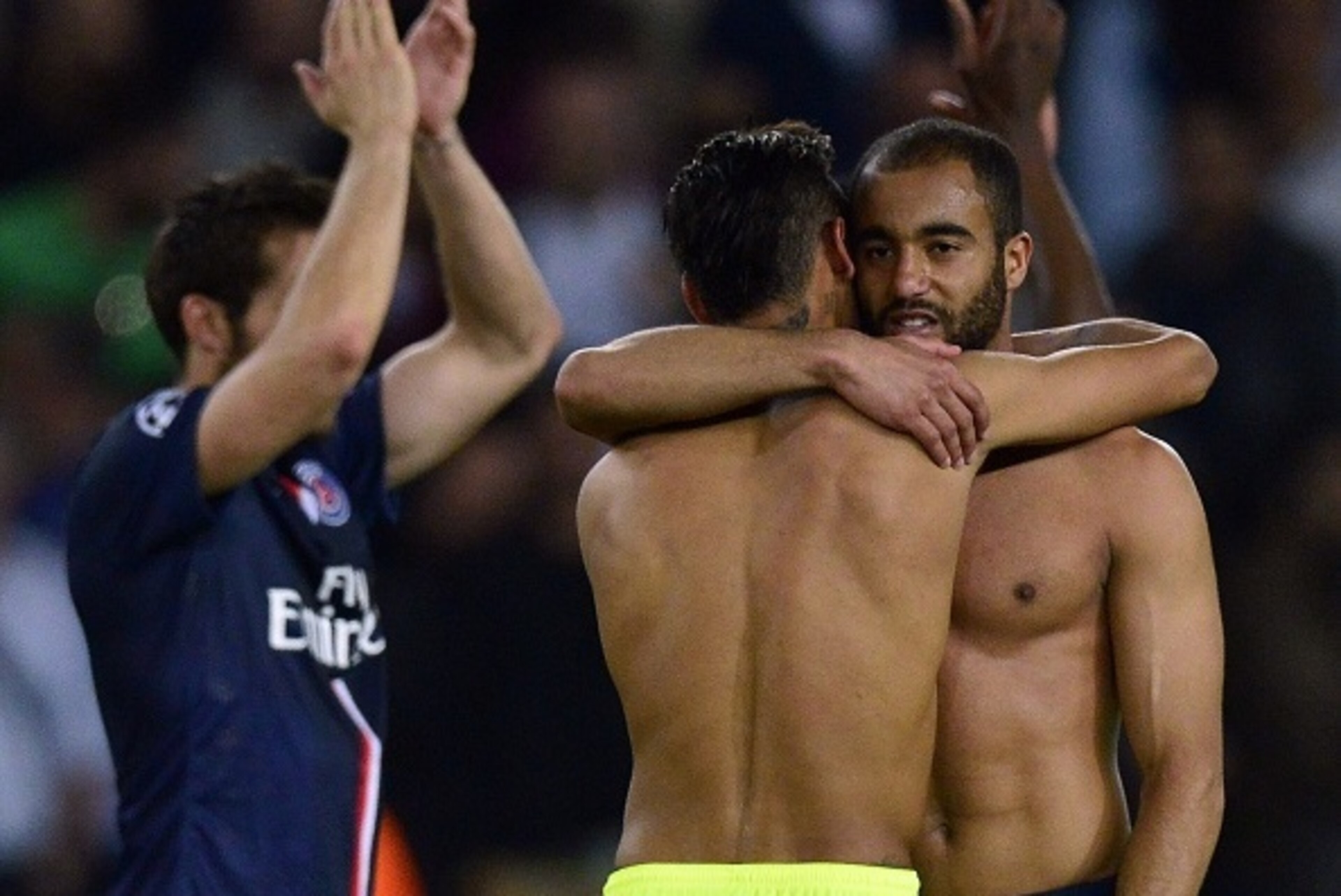 Barcelona's Brazilian forward Neymar da Silva Santos Junior (L) comforts Paris Saint-Germain's Brazilian midfielder Lucas Moura at the end of the UEFA Champions league quarter-final first leg football match PSG vs FC Barcelona at the Parc des Princes stad