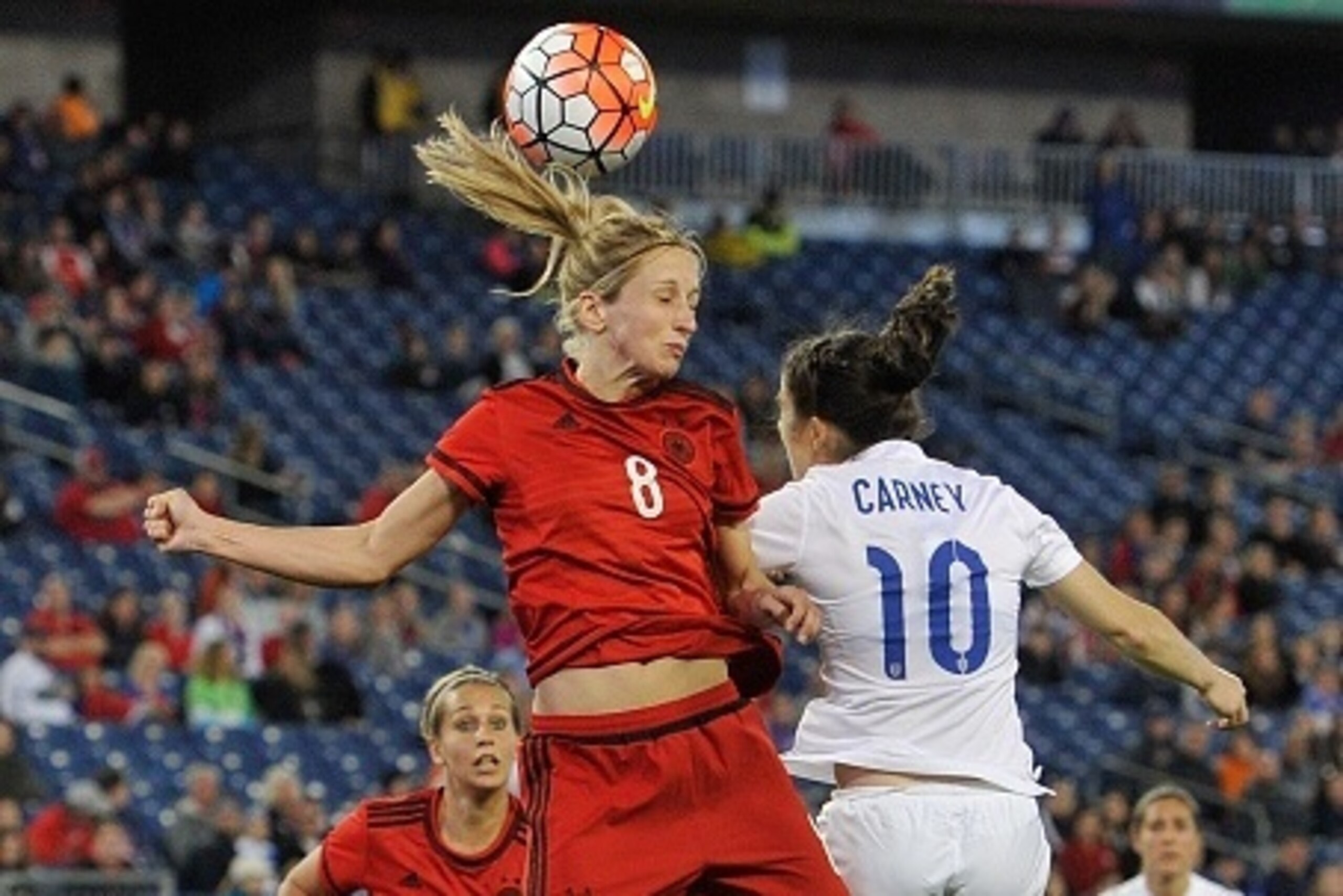 NASHVILLE, TENNESSEE - MARCH 06:  Kathrin Hendrich #8 of Germany heads a ball past Karen Carney #10 of England during the second half of a friendly international match in the Shebelieves Cup at Nissan Stadium on March 6, 2016 in Nashville, Tennessee.  (Ph