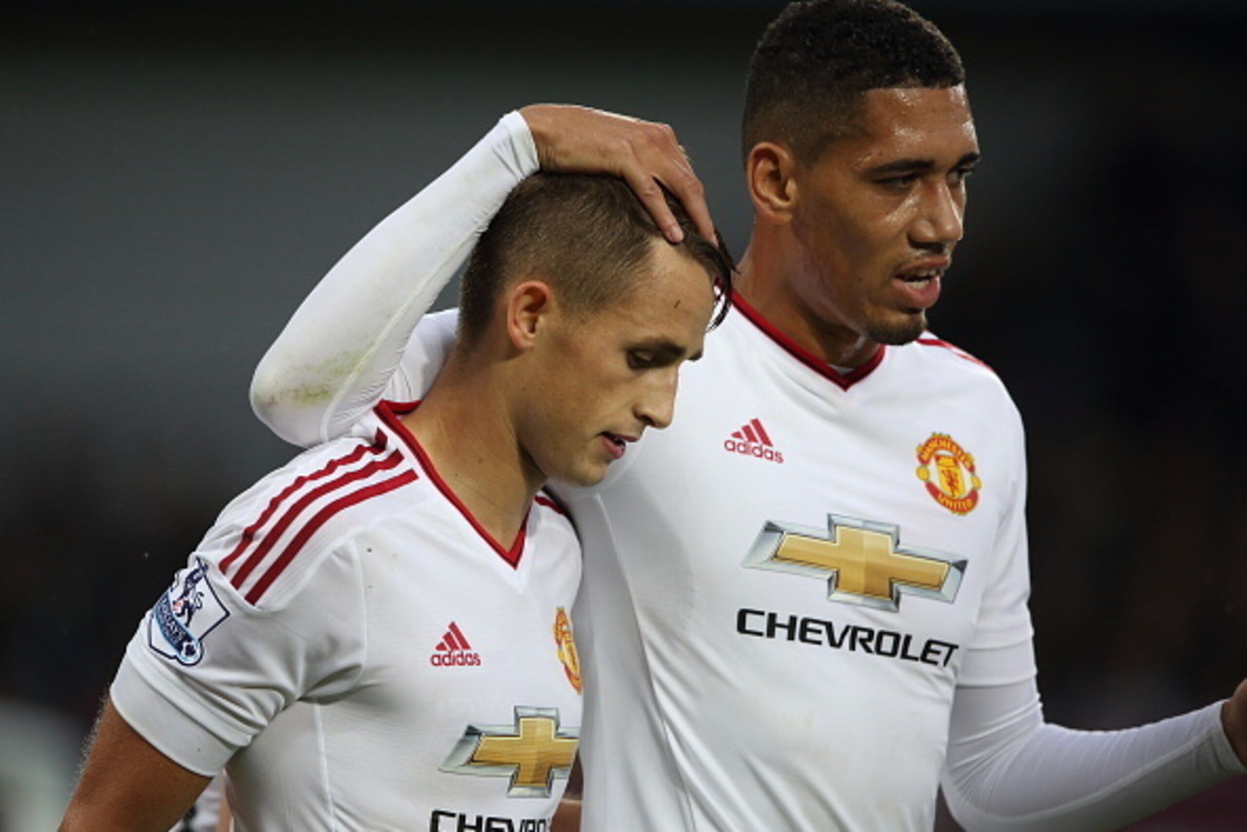 BIRMINGHAM, ENGLAND - AUGUST 14:  Adnan Januzaj (L) of Manchester United celebrates with team-mate Chris Smalling after scoring a goal to make it 0-1 during the Barclays Premier League match between Aston Villa and Manchester United at Villa Park on Augus
