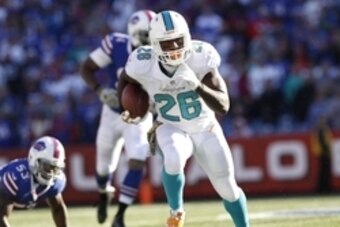 Nov 8, 2015; Orchard Park, NY, USA; Miami Dolphins running back Lamar Miller (26) runs with the ball against the Buffalo Bills during the first half at Ralph Wilson Stadium. Mandatory Credit: Kevin Hoffman-USA TODAY Sports