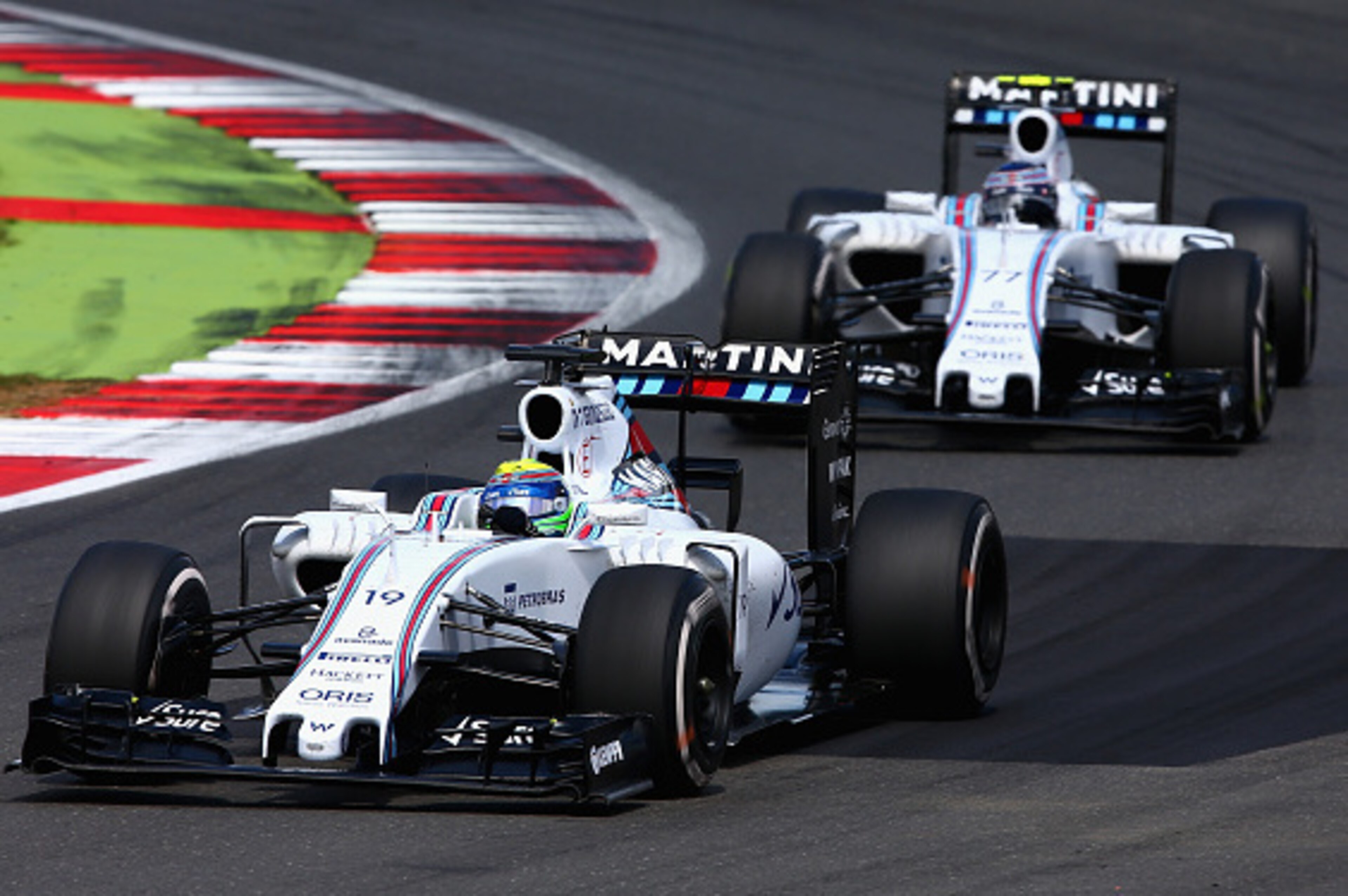 NORTHAMPTON, ENGLAND - JULY 05:  Felipe Massa of Brazil and Williams drives ahead of Valtteri Bottas of Finland and Williams during the Formula One Grand Prix of Great Britain at Silverstone Circuit on July 5, 2015 in Northampton, England.  (Photo by Cliv