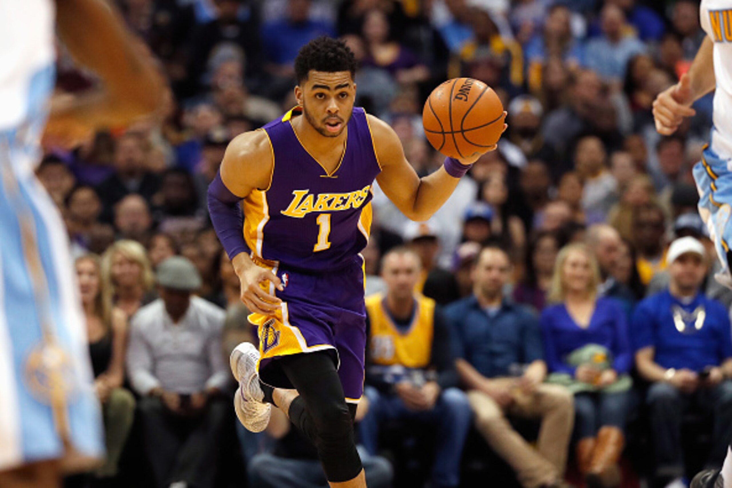 DENVER, CO - MARCH 02: D'Angelo Russell #1 of the Los Angeles Lakers controls the ball against the Denver Nuggets at Pepsi Center on March 2, 2016 in Denver, Colorado. The Nuggets defeated the Lakers 117-107. NOTE TO USER: User expressly acknowledges and DENVER, CO - MARCH 02: D'Angelo Russell #1 of the Los Angeles Lakers controls the ball against the Denver Nuggets at Pepsi Center on March 2, 2016 in Denver, Colorado. The Nuggets defeated the Lakers 117-107. NOTE TO USER: User expressly acknowledges and